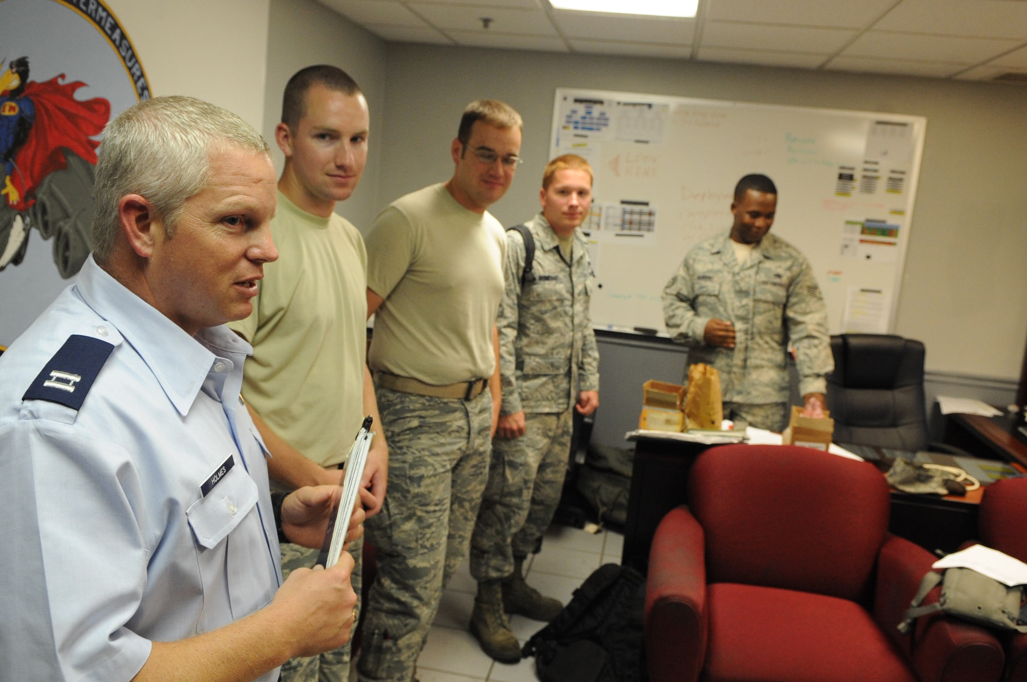 Chaplain (Capt.) Richard Holmes, a member of the 2nd Bomb Wing Chaplain Corps, visits with Airmen from the 2nd Aircraft Maintenance Squadron on Barksdale Air Force Base, La., July 18. Holmes is the tenant chaplain for the 2nd Maintenance Group and 2nd Operations Group, and he routinely makes rounds to visits with Airmen to boost morale and inform them of his open door policy. (U.S. Air Force photo Airman 1st Class Micaiah Anthony)(RELEASED)