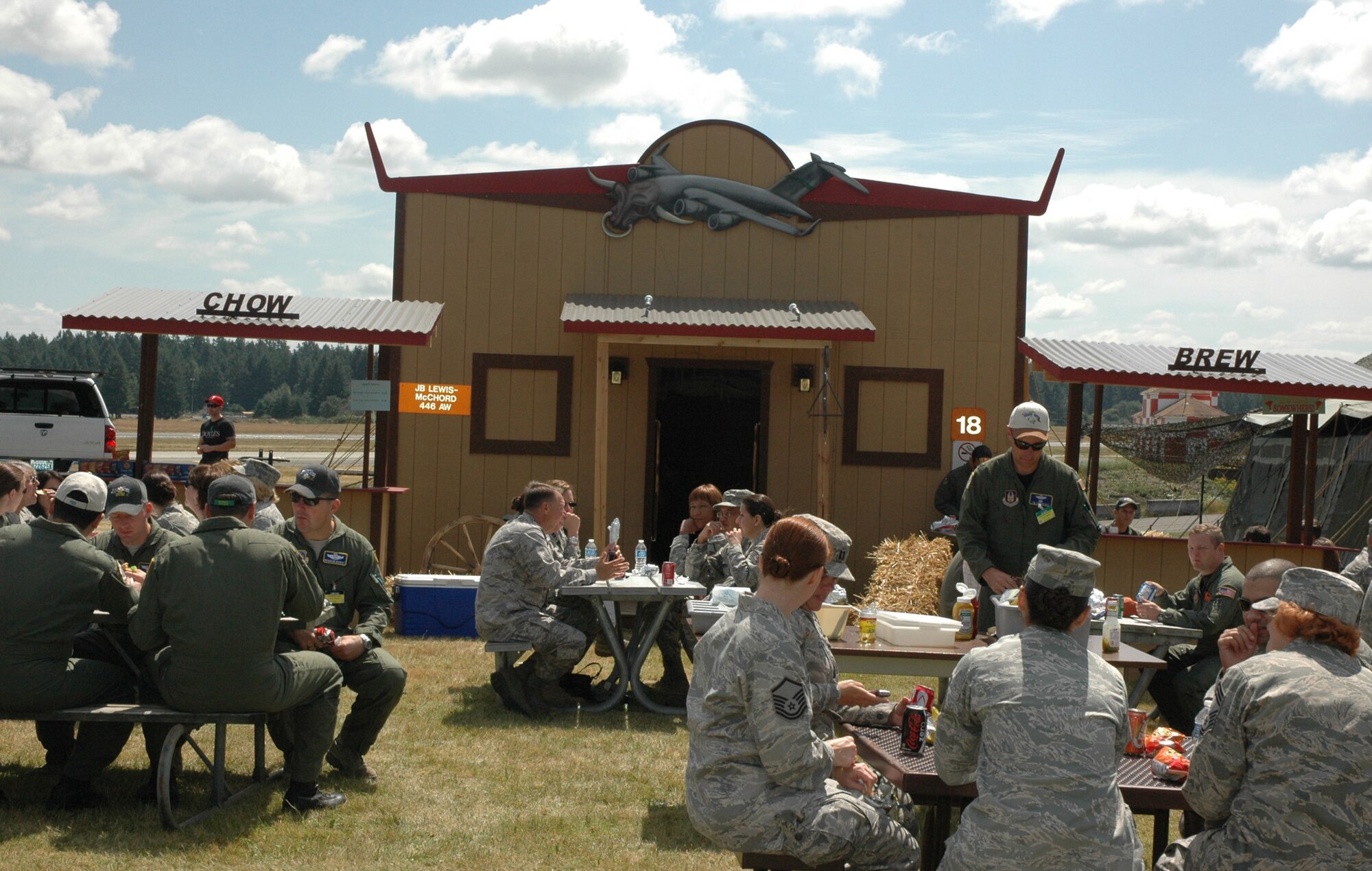 Visitors enjoy lunch at the 446th Airlift Wing's tent at Rainier Ranch at McChord Field, Wash., July 22. The Reserve wing's tent will be serving lunch to all comers July 23-29. (U.S. Air Force photo by Sandra Pishner)
