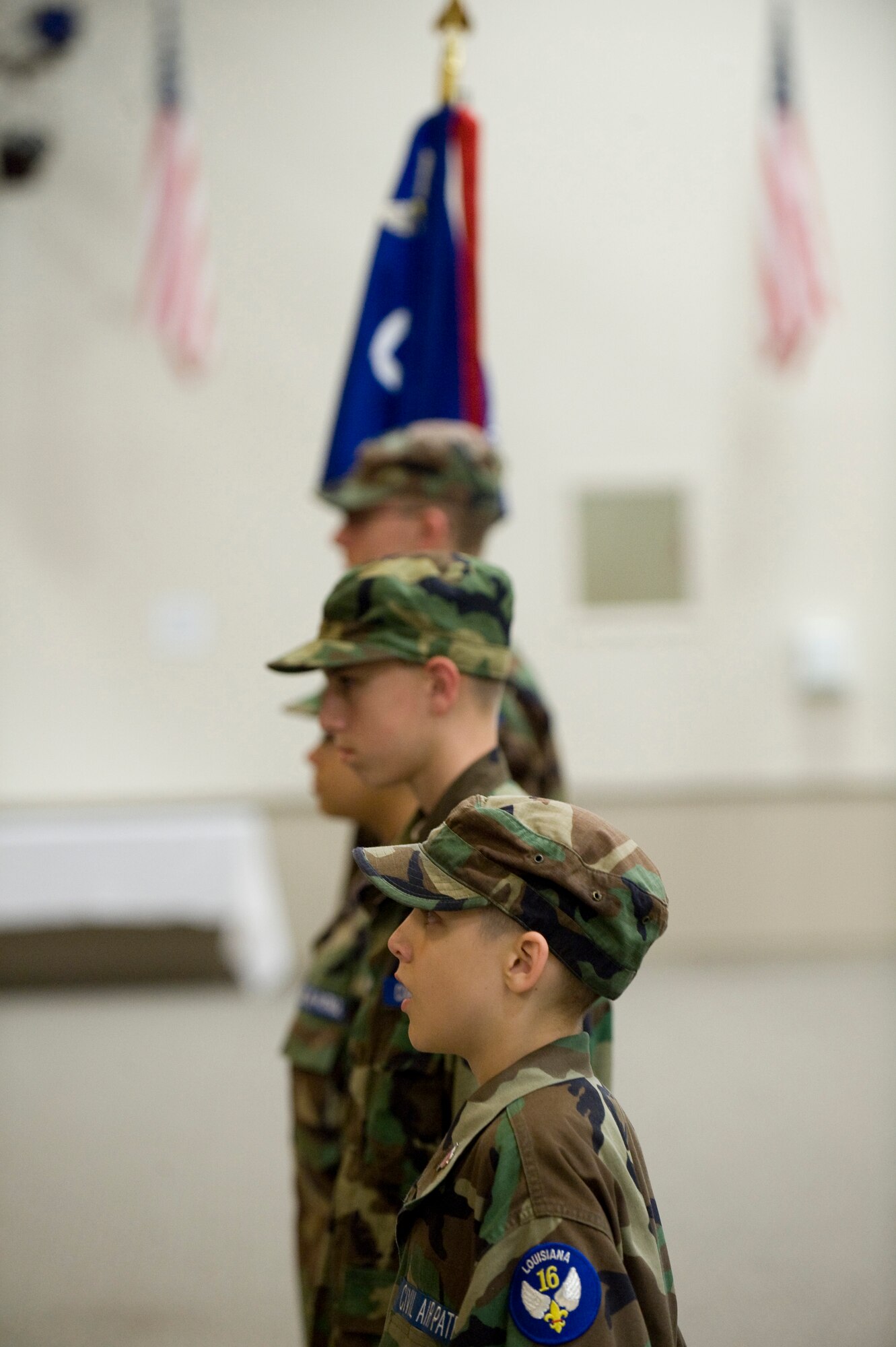 Cadets with the Louisiana Civil Air Patrol Cadet Encampment stand at attention during a drill competition in Hoban Hall on Barksdale Air Force Base, La., July 22. This is the 14th consecutive year Barksdale has hosted the encampment. (U.S. Air Force photo/Senior Airman Chad Warren) (RELEASED)