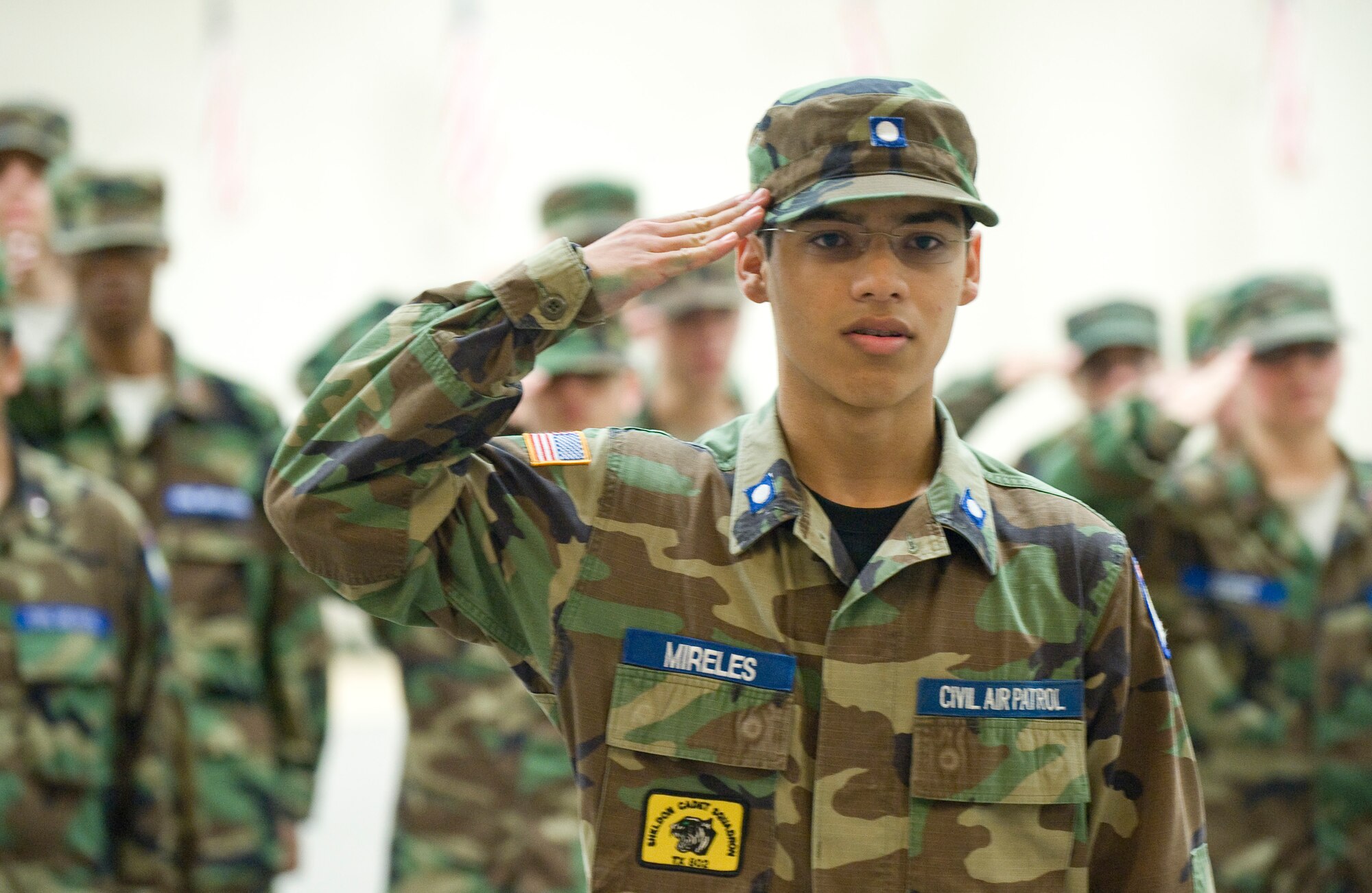 Cadet 2nd Lt. Anthony Mireles, 15, presents his flight during a drill competition in Hoban Hall on Barksdale Air Force Base, La., July 22. Mireles commanded one of the four flights which participated in the competition. (U.S. Air Force photo/Senior Airman Chad Warren) (RELEASED)