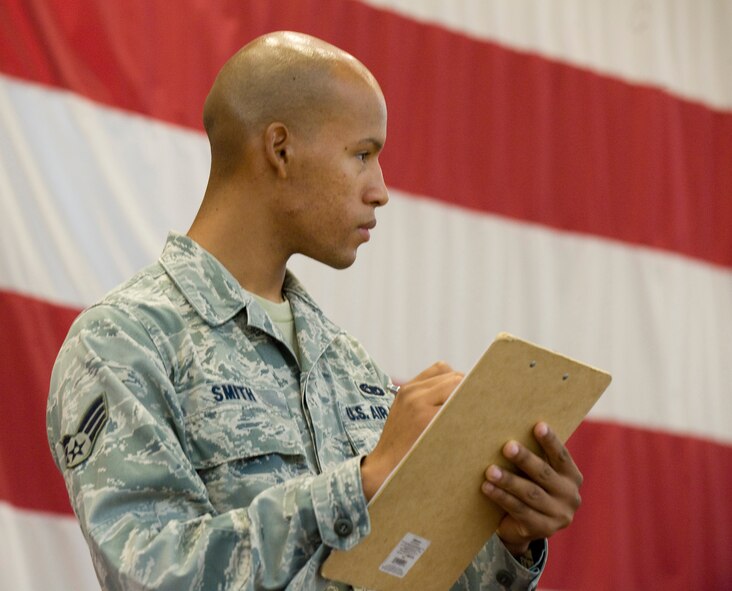 Senior Airman Calvin Smith, Barksdale Honor Guard, judges a drill competition during the Louisiana Civil Air Patrol Cadet Encampment in Hoban Hall on Barksdale Air Force Base, La., July 22. The cadets competed against each other, completing a series of drill movements judged by members of the base honor guard. (U.S. Air Force photo/Senior Airman Chad Warren) (RELEASED)