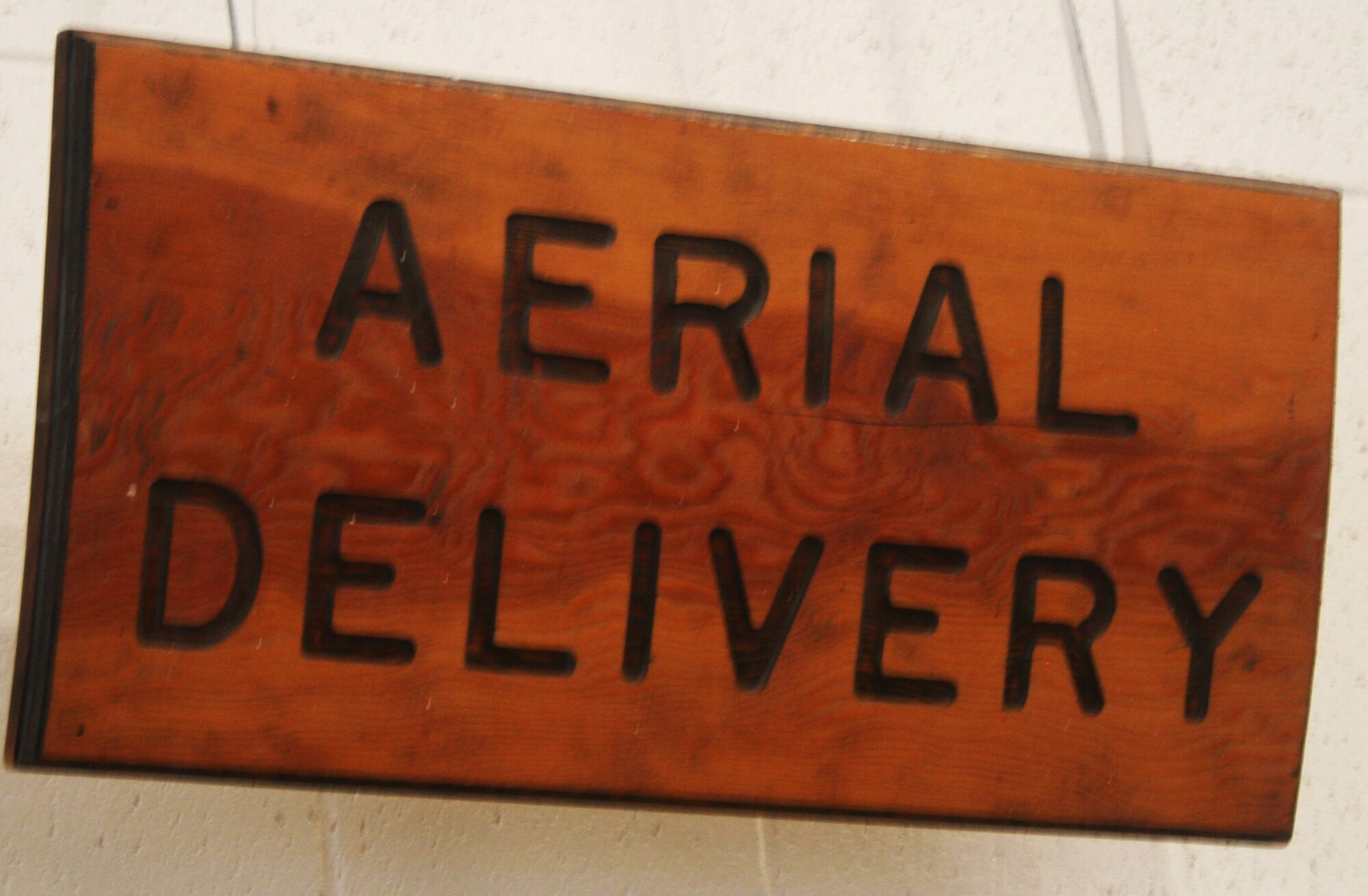 A hand-made sign showing "aerial delivery" is shown in the 62nd Aerial Port Squadron aerial delivery facility July 21, 2011, at Joint Base Lewis-McChord, Wash. Eight people operate the facility and prepare airdrop training bundles for the 62nd Airlift Wing's mission. (U.S. Air Force Photo/Master Sgt. Scott T. Sturkol)
