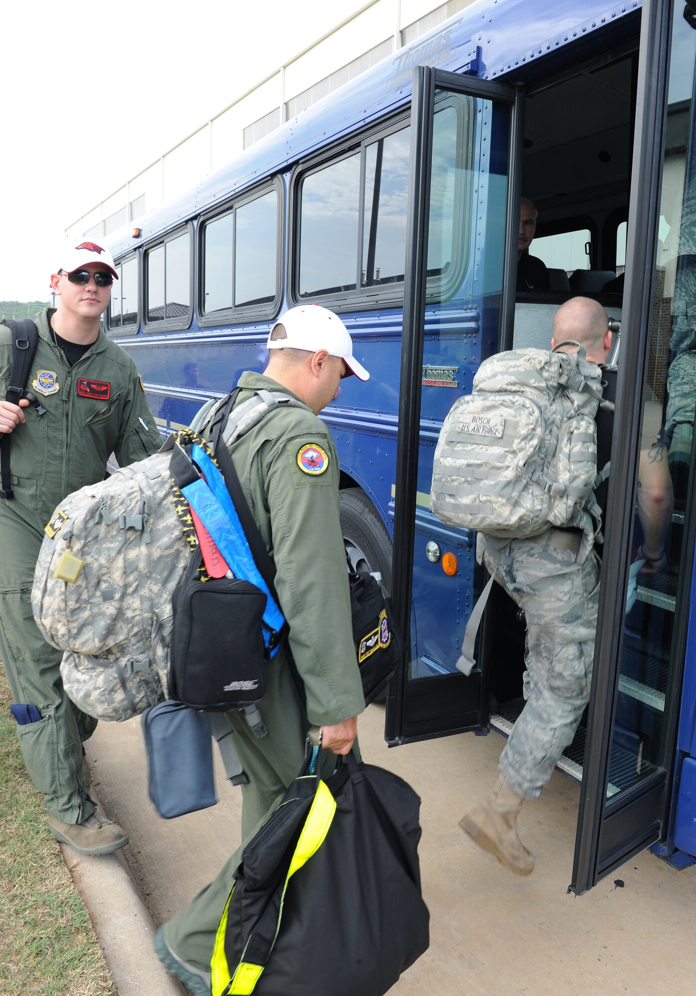 Little Rock RODEO teams board buses July 22, 2011, at Little Rock Air Force Base, Ark. The Air Mobility Command RODEO competition, which focuses on improving worldwide air mobility forces' professional core abilities, is from July 24-29, 2011, at Joint Base Lewis-McChord Air Force Base, Wash. (U.S. Air Force photo by Airman 1st Class Ellora Remington)