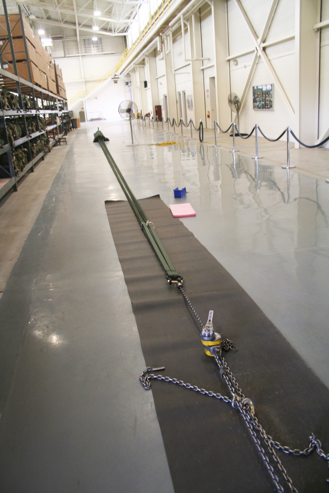 A parachute for an airdrop bundle is shown stretched out nearly 90 feet in the 62nd Aerial Port Squadron aerial delivery facility July 21, 2011, at Joint Base Lewis-McChord, Wash. Eight people operate the facility and prepare airdrop training bundles for the 62nd Airlift Wing's mission. (U.S. Air Force Photo/Master Sgt. Scott T. Sturkol)