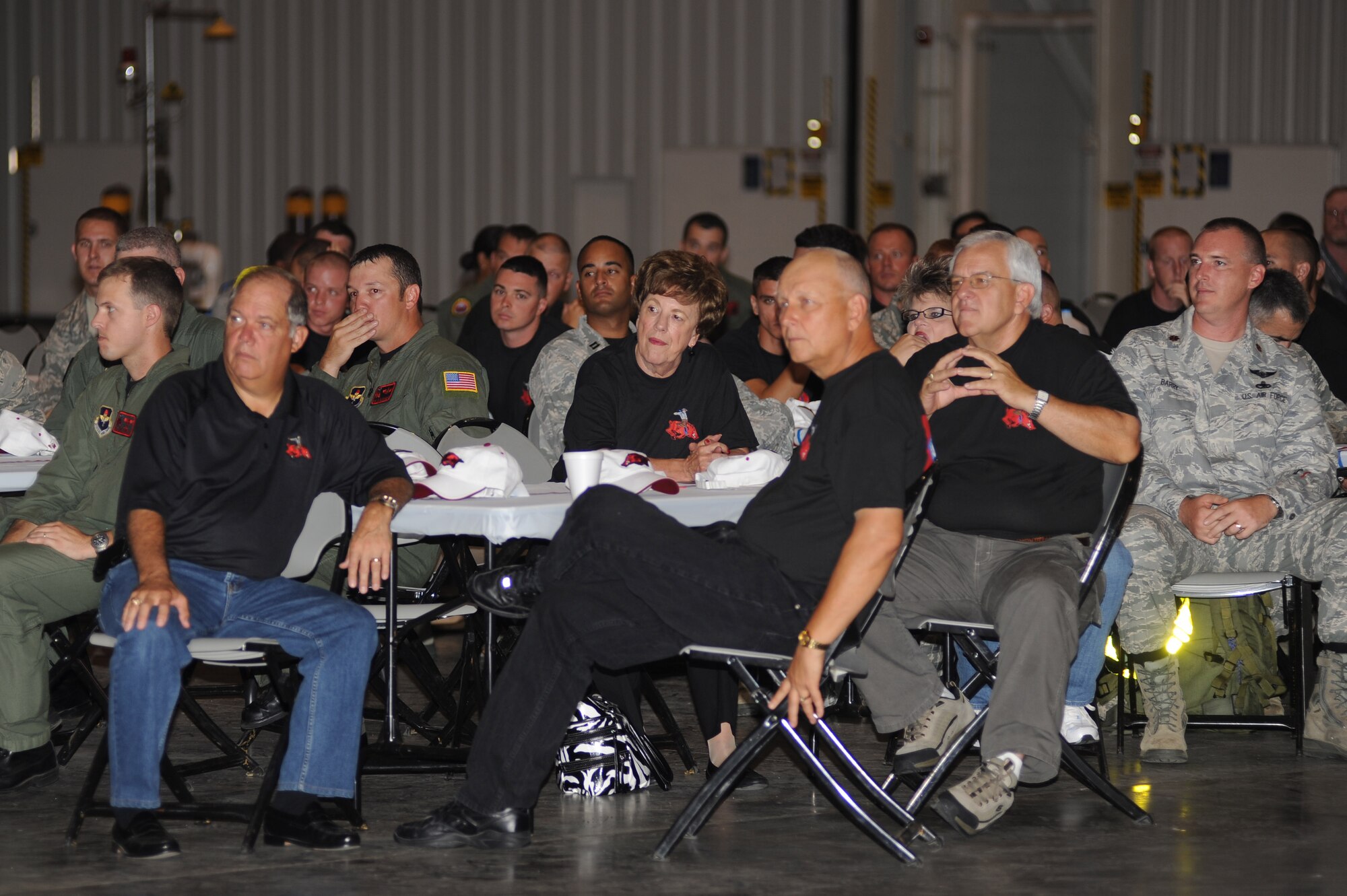 Civic leaders and Airmen from the Little Rock RODEO team listen to opening remarks by Col. Mike Minihan, 19th Airlift Wing commander, and Col. Mark Czelusta, 314th Airlift Wing commander, at the 2011 Air Mobility Command RODEO send off July 22, 2011, at Little Rock Air Force Base, Ark.  The Little Rock RODEO team will be competing with DOD, as well as, allied nations to enhance air mobility operations and promote esprit de corps during the AMC RODEO 2011, held at McChord Field on Joint Base Lewis-McChord, Wash., from July 24 to July 29. (U.S. Air Force photo by Tech. Sgt. Chad Chisholm)