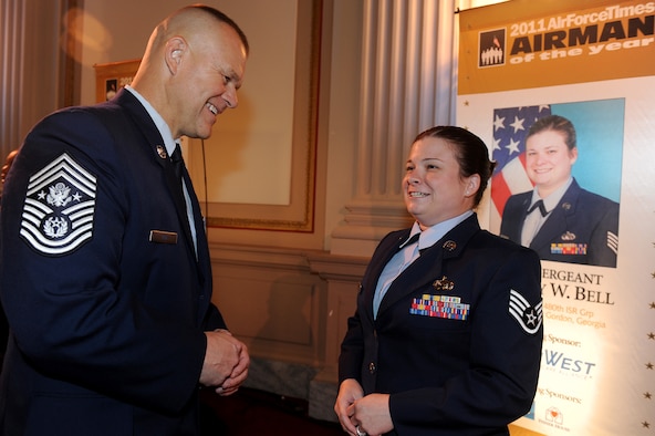Chief Master Sgt. of the Air Force James A. Roy congratulates Staff Sgt. Lindsay Bell July 21, 2011, in Washington, D.C. Bell, assigned to the 31st Intelligence Squadron at Fort Gordon, Ga., is the 2011 Air Force Times Airman of the Year, and was honored at the Military Times Service Member of the Year Awards Ceremony in the House of Representatives' Cannon Building. (U.S. Air Force photo/Scott M. Ash)