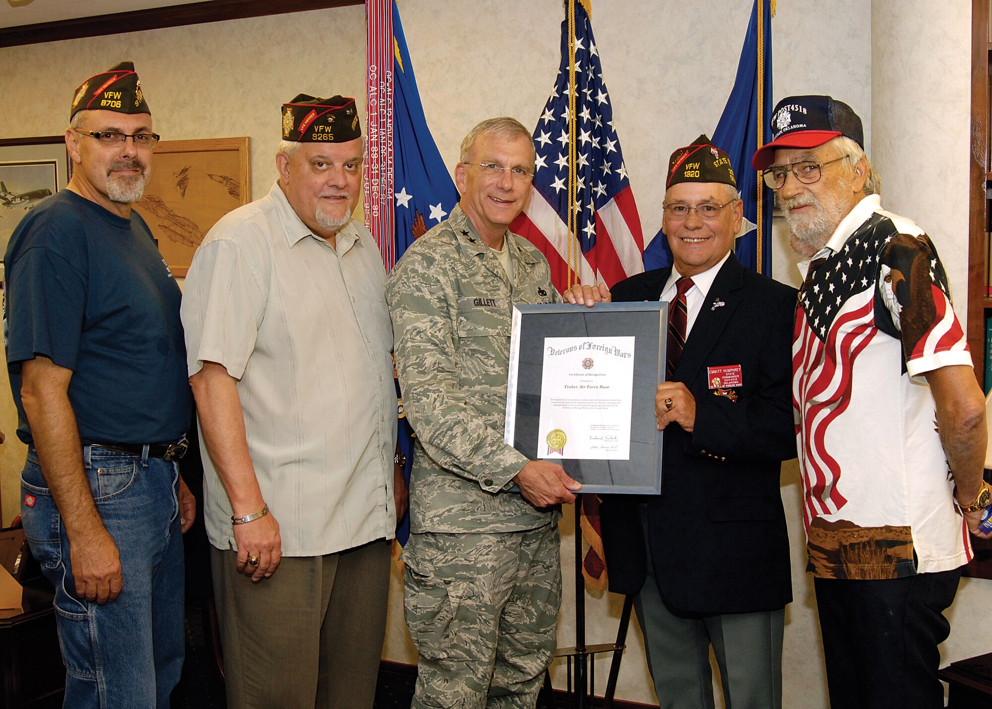 Maj. Gen. David Gillett accepts a certificate of recognition from the Veterans of Foreign Wars July 15, recognizing Tinker for its high percentage of hiring veterans through the years.  Figures indicate Tinker new employees were comprised of more than 35 percent veterans each year for the last five years. Officials said the number of veterans hired in the last five years is more than 2,000. Presenting the certificate to the Oklahoma City Air Logistics Center commander were, from left; Michael Devenitch, VFW state senior-vice commander and Tinker TF-33 engine mechanic; Charles Lawrence, VFW department adjutant/quartermaster;  Emmitt (Leroy) Humphrey, Oklahoma VFW commander; and Larry Moore, Oklahoma VFW chief of staff. (Air Force photo by Micah Garbarino)
