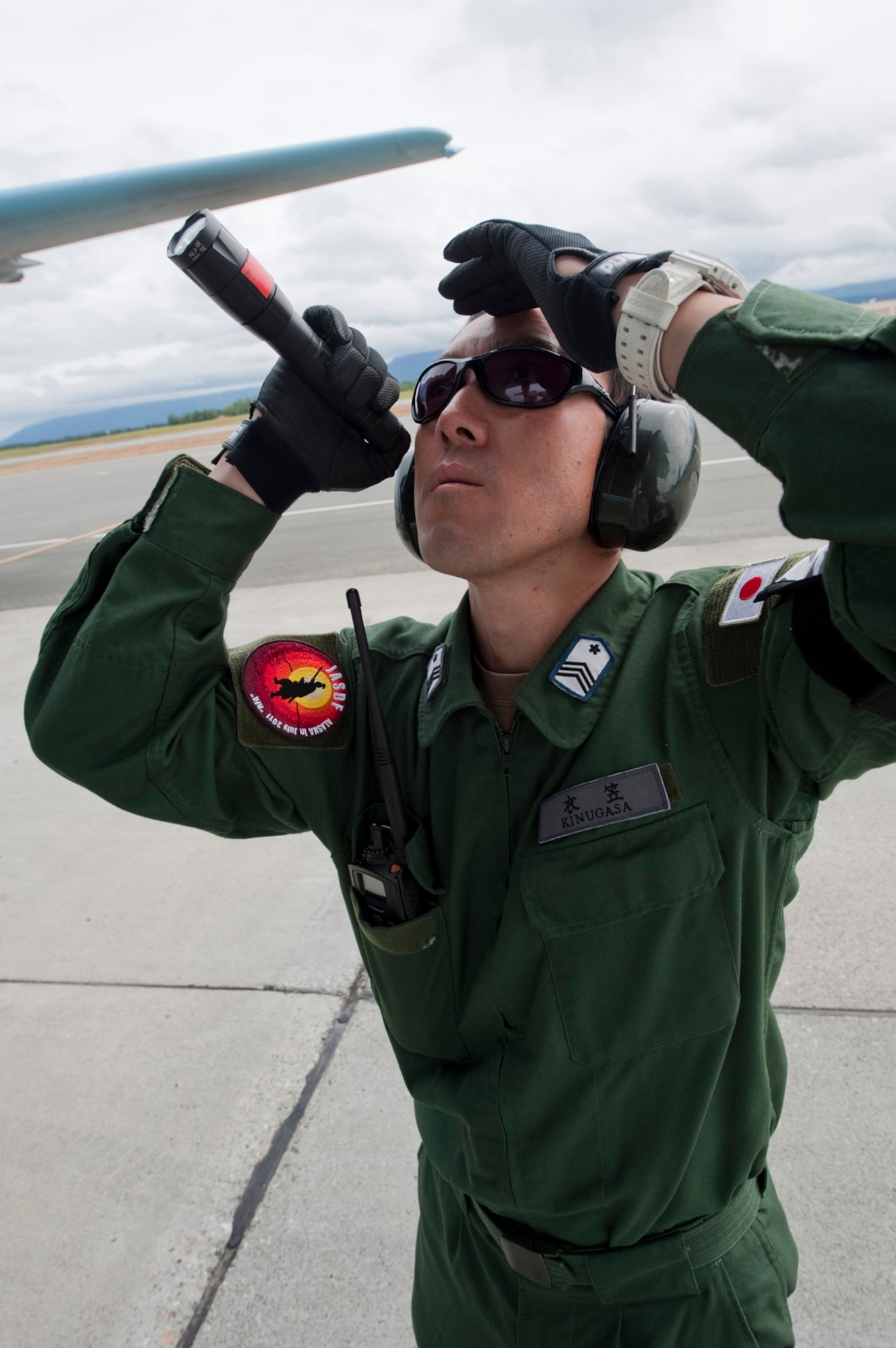 JOINT BASE ELMENDORF-RICHARDSON, Alaska ???- A member of the Japan Self-Defense Force makes a pre-flight inspection of a C-130 Hercules here July 18 during Red Flag-Alaska 11-2. RF-Alaska started July 11 and is scheduled to carry through to till July 22. Approximately 200 members of JASDF participated in RF-Alaska. (U.S. Air Force photo/Senior Airman Christopher Gross)