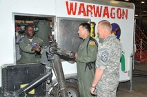 Above, Chief Master Sgt. James Cody, AETC command chief, right, listens while Tech. Sgt. Josemaria Gonzales, 58th Training Squadron, center, instructs Gen. Edward A. Rice Jr. on operating the GAU-2 minigun.

Photo by Todd Berenger