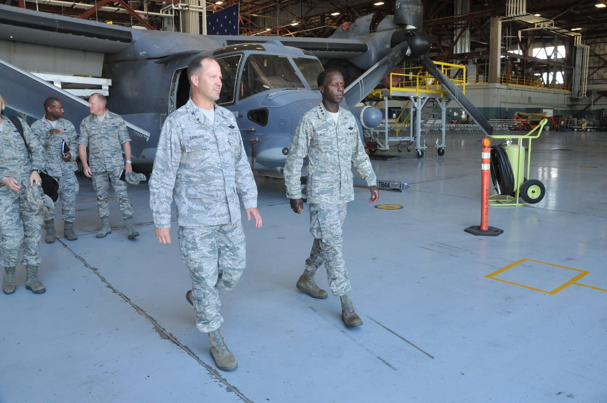 Col. James Cardoso, 58th Special Operations Wing commander, front left, Gen. Edward A. Rice Jr., Air Education and Training Command commander, front right, Chief Master Sgt. James Cody, AETC command chief, back right, and Col. Harold
Wilson, 58th Maintenance Group commander, back left, tour the CV-22 maintenance area at Kirtland AFB.

Photo by Todd Berenger