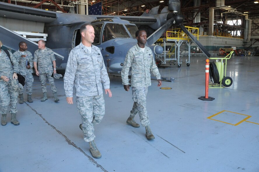 Col. James Cardoso, 58th Special Operations Wing commander, front left, Gen. Edward A. Rice Jr., Air Education and Training Command commander, front right, Chief Master Sgt. James Cody, AETC command chief, back right, and Col. Harold
Wilson, 58th Maintenance Group commander, back left, tour the CV-22 maintenance area at Kirtland AFB.

Photo by Todd Berenger