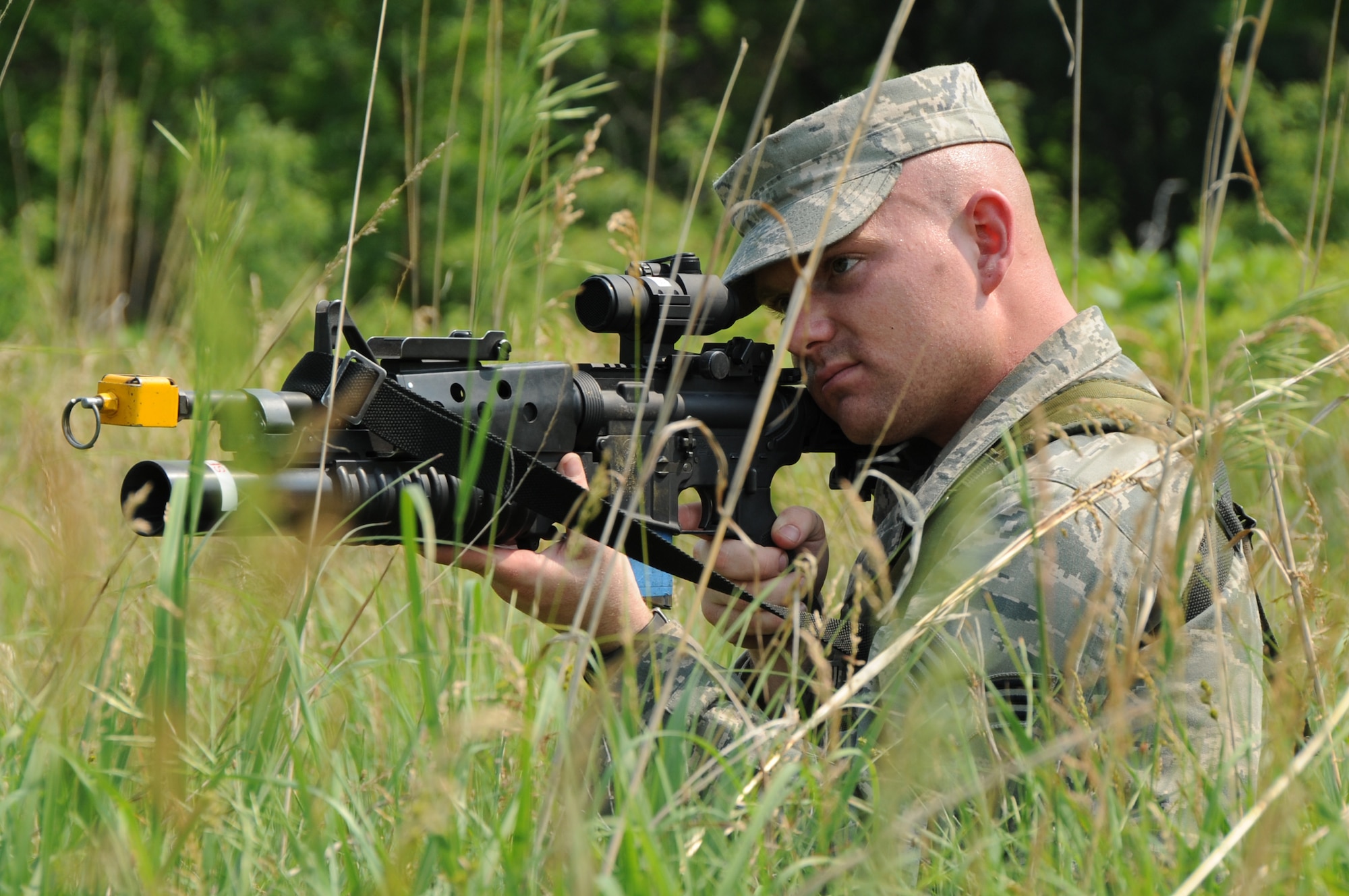 Providing Cover: Senior Airman Tyson Pierce, a fire team member with the 155th Security Forces Squadron, keeps lookout during a field patrol exercise at Camp Ashland, Neb., June 6. The members of the 155th SFS performed a field training training exercise during their annual training to conduct combat skills training 