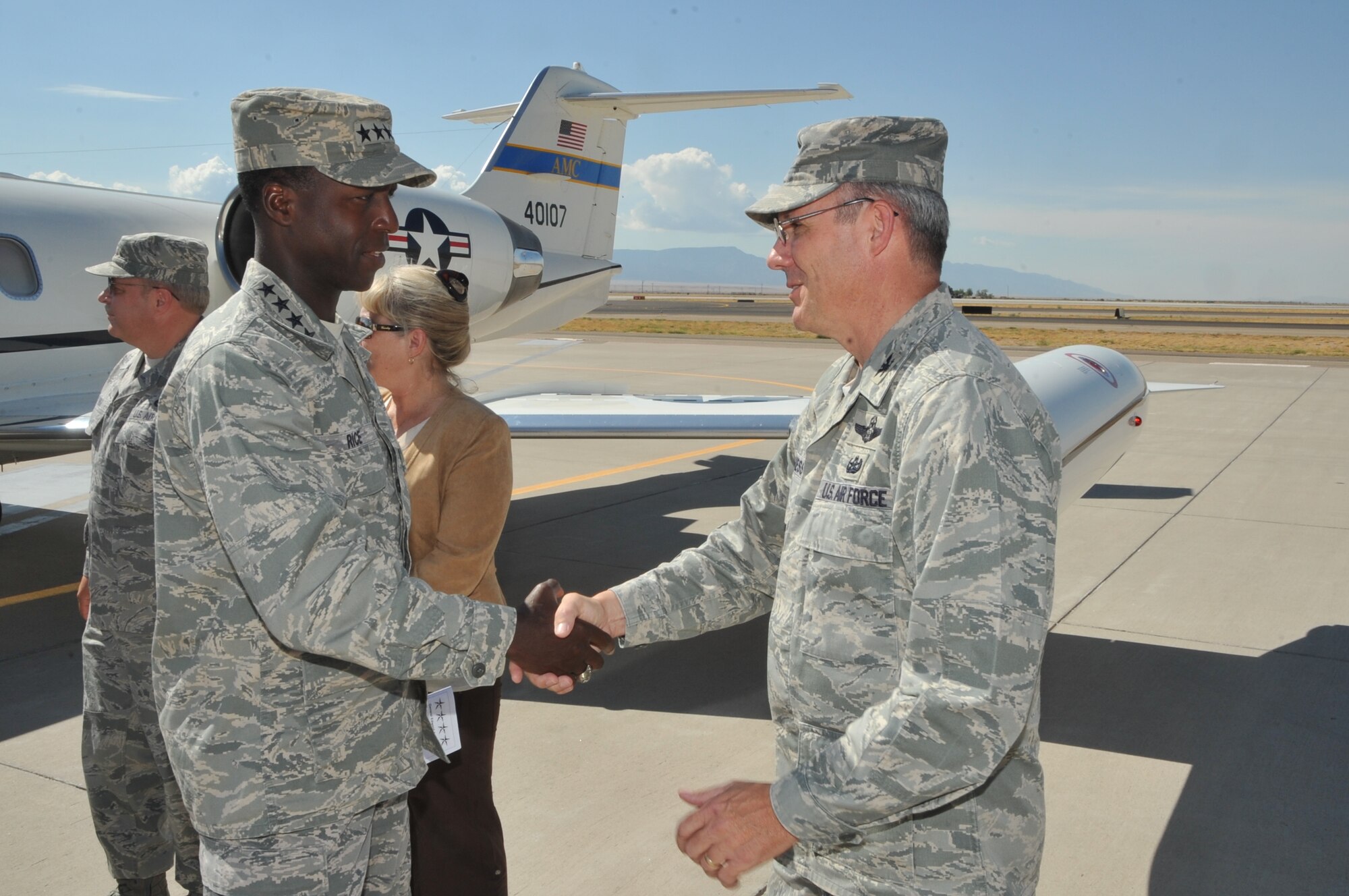 Col. Robert L. Maness, 377th Air Base Wing commander, greets Gen. Edward A. Rice Jr., Air Education and Training Command commander, on his arrival at Kirtland Air Force Base.