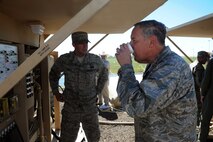 MINOT AIR FORCE BASE, N.D. -- Maj. Gen. Donald Alston drinks water derived from the reverse osmosis water purification units here July 20. Alston visited Team Minot to learn about the recent flood and how it has affected Airmen. (U.S. Air Force photo/Senior Airman Aaron-Forrest Wainwright)