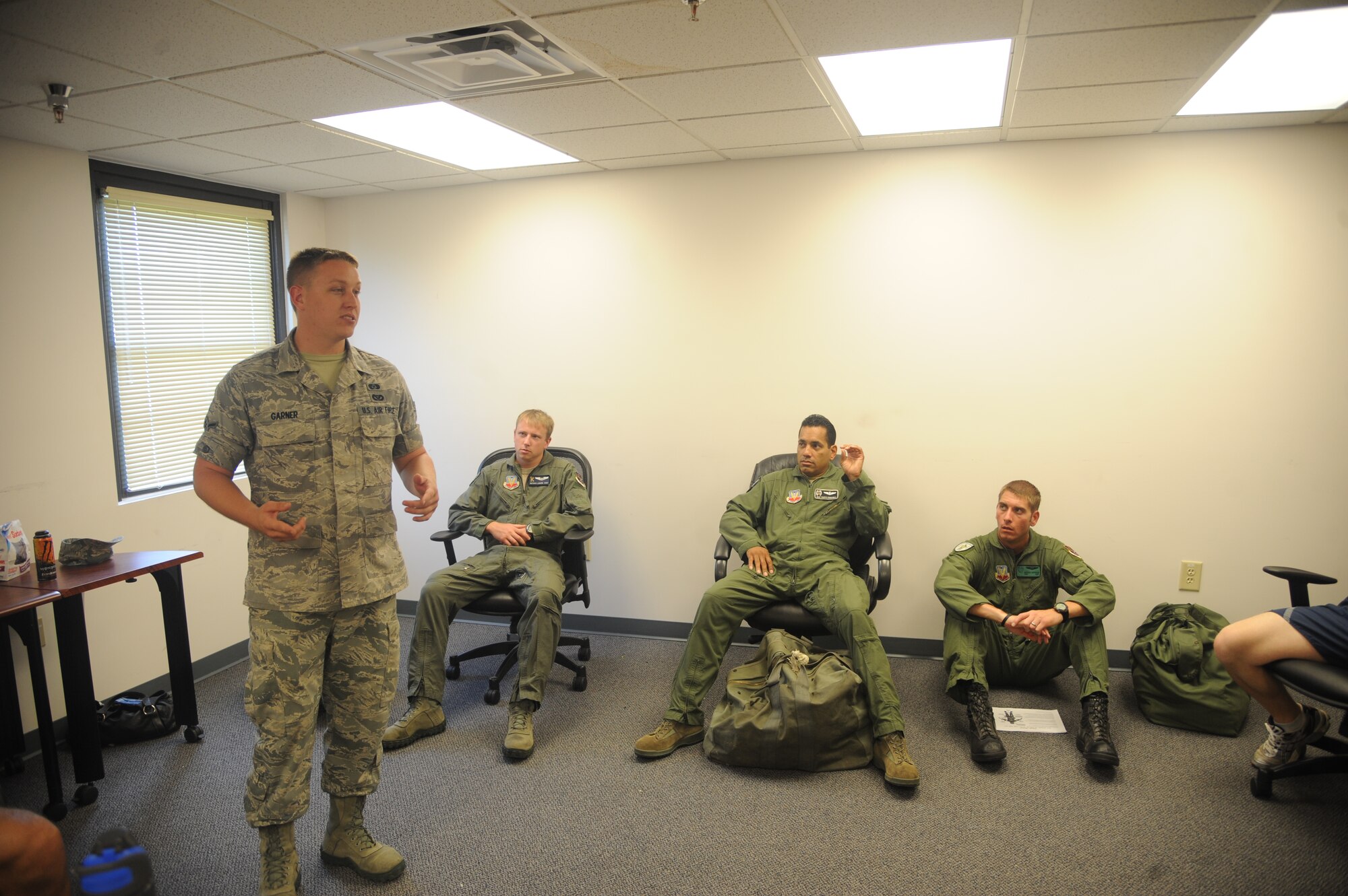 U.S. Air Force Airman Dustin Garner, 23rd Civil Engineer Squadron readiness emergency management, goes over objectives during an ability to survive and operate rodeo training session at Moody Air Force Base, Ga., July 22, 2011. Members from the exercise evaluation team gained knowledge to pass to their units. (U.S. Air Force photo by Airman 1st Class Paul Francis/Released)
