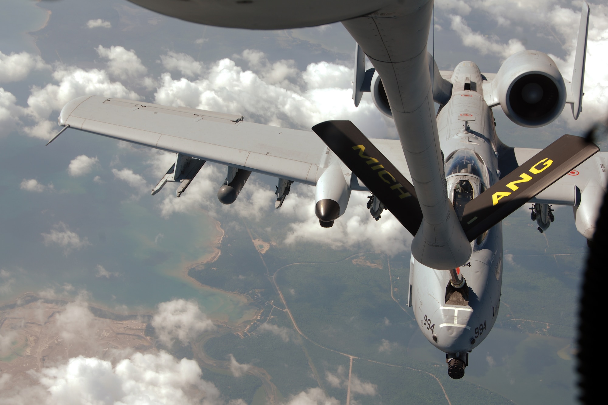 An A-10 Thunderbolt II receives fuel from a KC-135 Stratotanker during an aerial refueling mission, July 21, 2011. Both aircraft are assigned to the 127th Wing of the Michigan Air National Guard and are based at Selfridge Air National Guard Base, Mich. (USAF photo by John S. Swanson)
