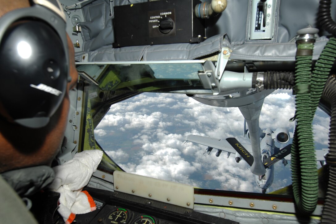 Master Sgt. George Hall operates the boom controls as an A-10 Thunderbolt II maneuvers in to receive fuel from a KC-135 Stratotanker during an aerial refueling mission, July 21, 2011. Both aircraft are assigned to the 127th Wing of the Michigan Air National Guard and are based at Selfridge Air National Guard Base, Mich. (USAF photo by John S. Swanson)