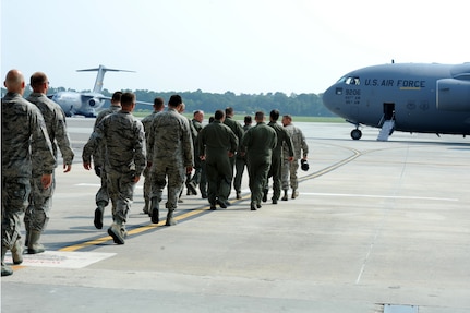 Team Charleston heads to the C-17 aircraft that will fly them to the Air Mobility Command 2011 Rodeo at Joint Base Lewis-McCord, Wash., July 22.  (U.S. Air Force photo/ Staff Sgt. Nicole Mickle)  (Released 