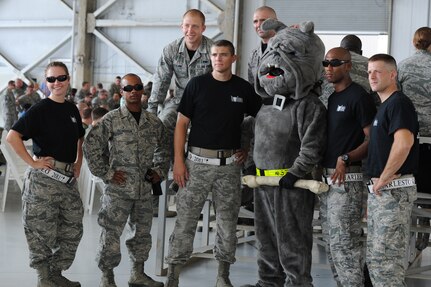 Civic leaders and members of the 437th Aerial Port Squadron's Rodeo Team gather around their "Port Dawg" mascot before the Rodeo Team departure ceremony June 22 at Joint Base Charleston - Air Base, S.C.  More than 30 Airmen from the 437th Airlift Wing and 628th Air Base Wing departed July 22 for Joint Base Lewis-McCord, Wash., to participate in Rodeo 2011. JB CHS Rodeo Team members have been preparing for this competition for several months and will compete alongside more than 150 teams and 3,000 people from the Air Force, Air Force Reserve, and Air National Guard, as well as 35 allied nations.  (U.S. Air Force photo/ Staff Sgt. Nicole Mickle)  