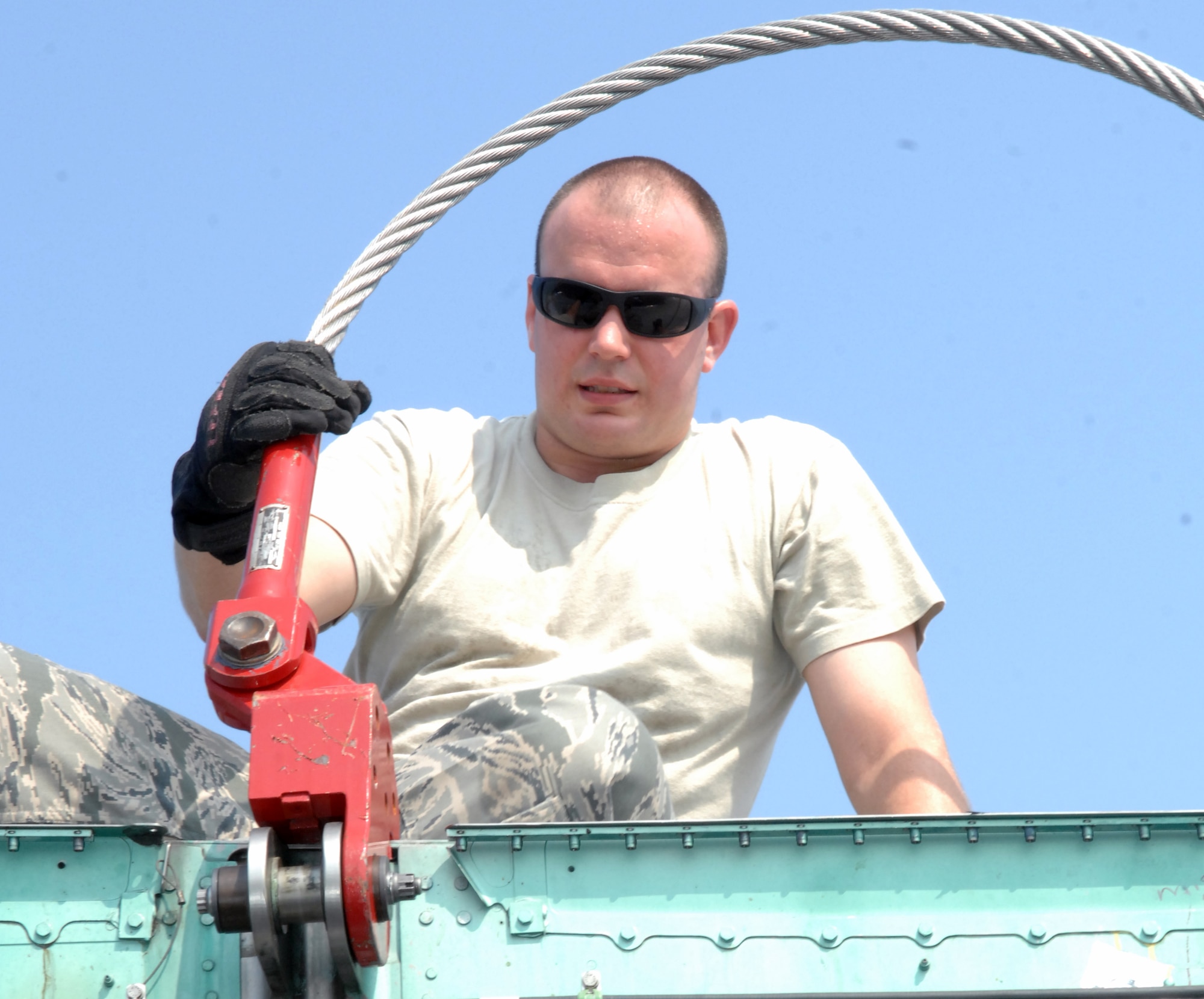 Staff Sgt. Michael Thorne, 1st Maintenance Squadron, Maintenance Flight, Package Maintenance and Plan Team member, hooks a sling to an F-15 Eagle July 21, at Langley Air Force Base, Va.  The F-15 will be transported to the Chico Air Museum in Chico, Calif., where it will be on permanent display as part of the “Freedom Eagle” exhibit. (U.S. Air Force photo by Staff Sgt. Jeff Nevison/Released)