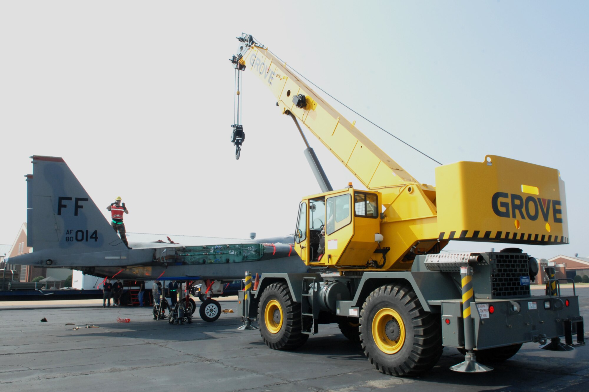 Airmen from the 1st Maintenance Squadron, Maintenance Flight, Package Maintenance and Plan team, use a crane to lift an F-15 Eagle to be secured on a flatbed truck July 21, at Langley Air Force Base, Va. The F-15 will be transported to the Chico Air Museum in Chico, Calif., where it will be on permanent display as part of the “Freedom Eagle” exhibit. (U.S. Air Force photo by Staff Sgt. Jeff Nevison/Released)