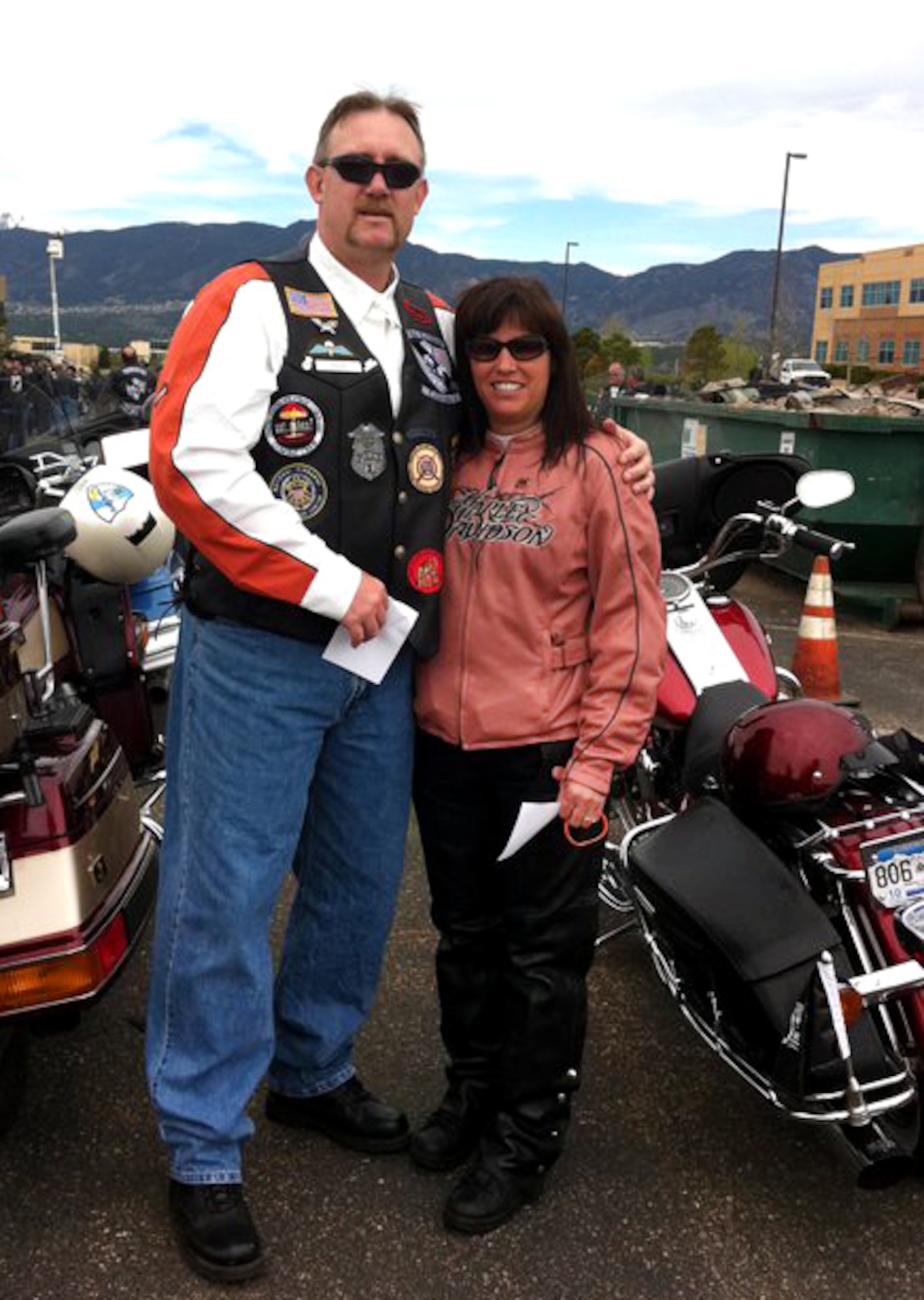 Tracy and 7th Space Operations Squadron Master Sgt. Karen Rouse, stand bytheir motorcycles before the Annual Pikes Peak Fallen Officers Memorial ride. Later that day, Master Sgt. Rouse's quick reaction to an accident by a fellow rider prevented further injury to the severely injured rider. Due to her training she was able to treat, stabilize and help prepare the accident victim for emergency evacuation. (Photo courtesy of Master Sgt. Karen Rouse)