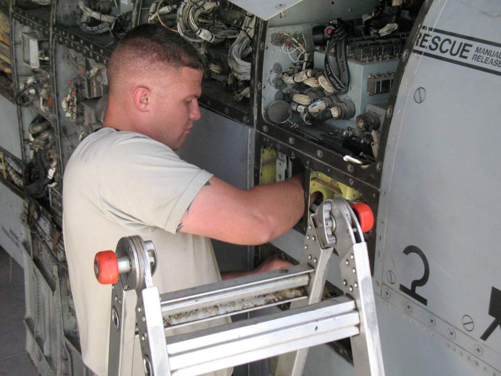 Staff Sergeant Stephen Bailey installs a roll crank during a phase inspection on an A-10 Thunderbolt II at Kandahar Airfield, Afghanistan. The A-10 support troops on the ground in combat in Afghanistan. Sergeant Bailey is assigned to the 451st Expeditionary Maintenance Squadron at Kandahar Airfield.