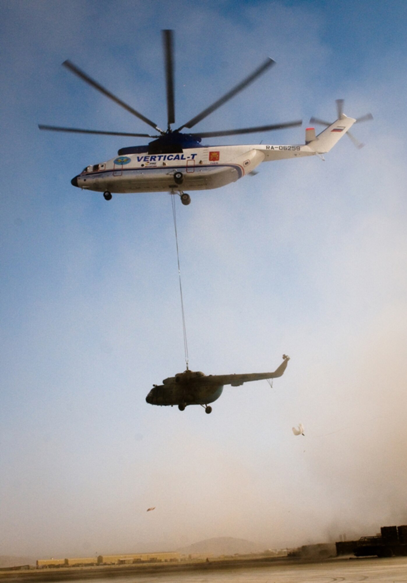 A damaged Mi-17 is carried on its way to a repair facility on Kandahar Airfield, Afghanistan on July 13, 2011. The helicopter is owned by the Afghan Kandahar Air Wing. (U.S. Air Force courtesy photo)