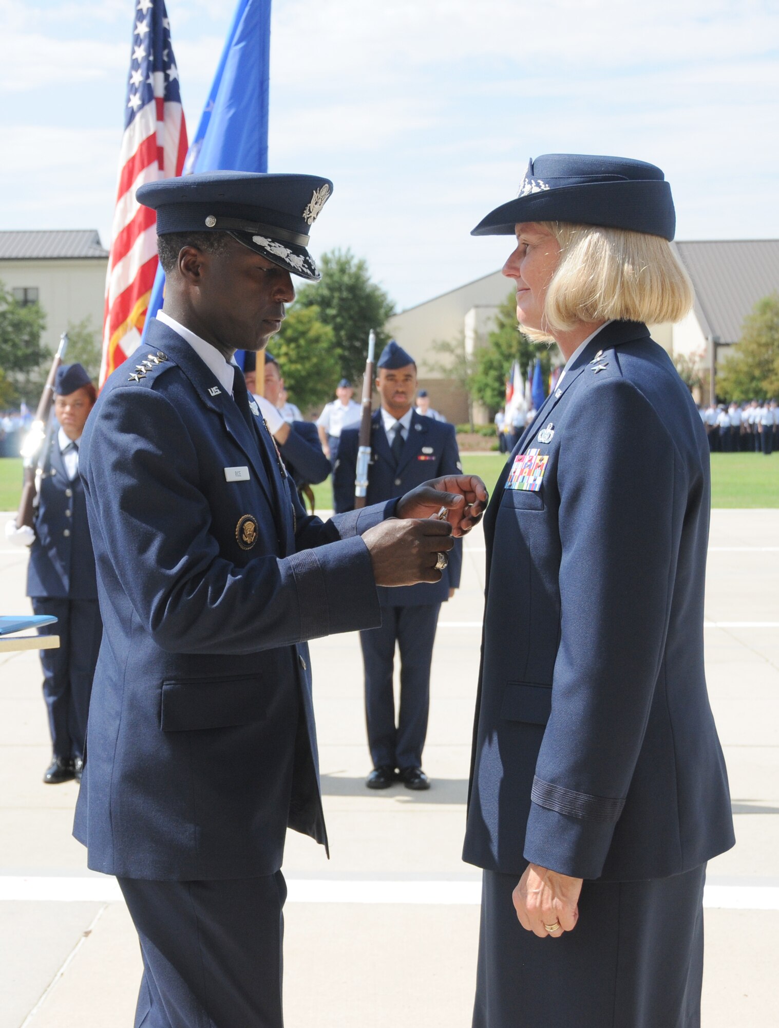 Gen. Edward Rice Jr., left, commander of Air Education and Training Command, presents the Distinguished Service Medal to Maj. Gen. Mary Kay Hertog, outgoing commander of 2nd Air Force, during the change of command ceremony July 21 at Keesler Air Force Base, Miss.   Hertog is headed to the Pentagon to direct the Department of Defense Sexual Assault Prevention and Response Office.  (U.S. Air Force photo by Kemberly Groue)
