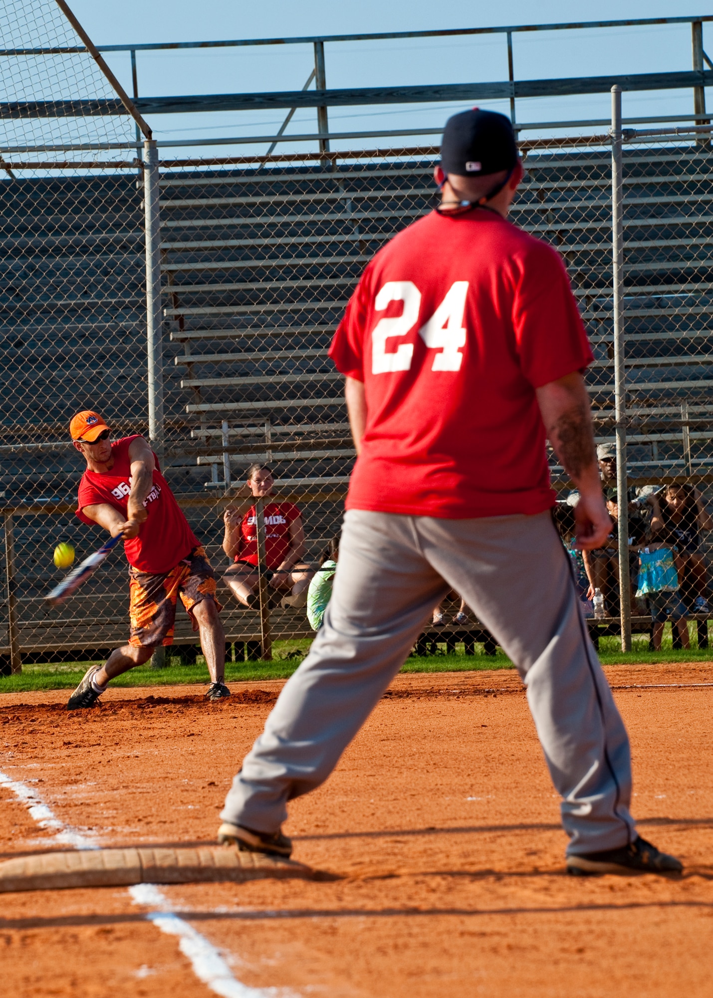 96th Medical Group's Zach Higgins is ready to run as Charles Dean swings during the intramural softball championship game against the 96th Security Forces Squadron at Eglin Air Force Base, Fla., July 20.  SFS came from behind in the final inning to take the championship 16-15.  (U.S. Air Force photo/Samuel King Jr.)