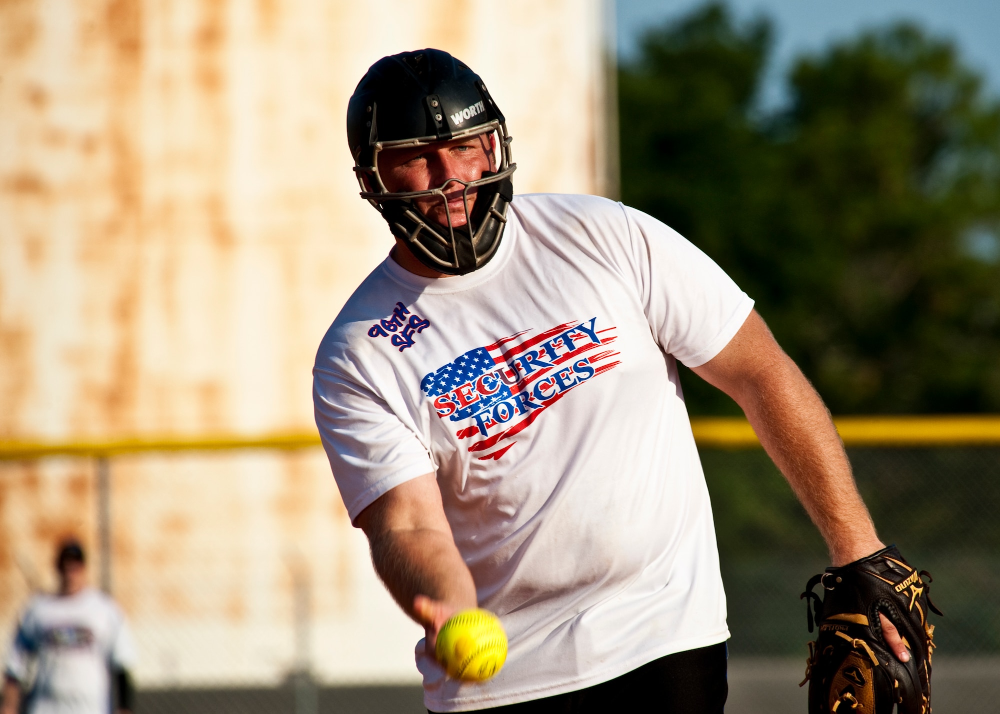 Branden Brader, of the 96th Security Forces Squadron, sends a pitch to home during the intramural softball championship game against the 96th Medical Group at Eglin Air Force Base, Fla., July 20.  SFS came from behind in the final inning to take the championship 16-15.  (U.S. Air Force photo/Samuel King Jr.)