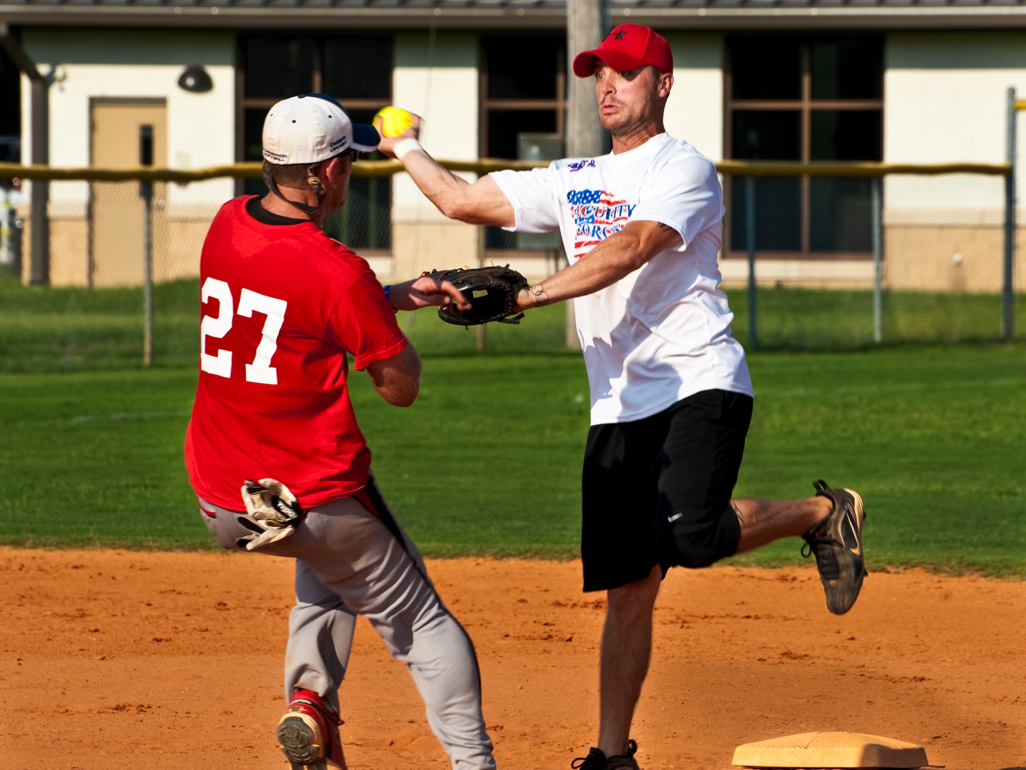 Jesse Schroeder, of the 96th Security Forces Squadron, tries to 'turn two' during the intramural softball championship game against the 96th Medical Group at Eglin Air Force Base, Fla., July 20.  SFS came from behind in the final inning to take the championship 16-15.  (U.S. Air Force photo/Samuel King Jr.)