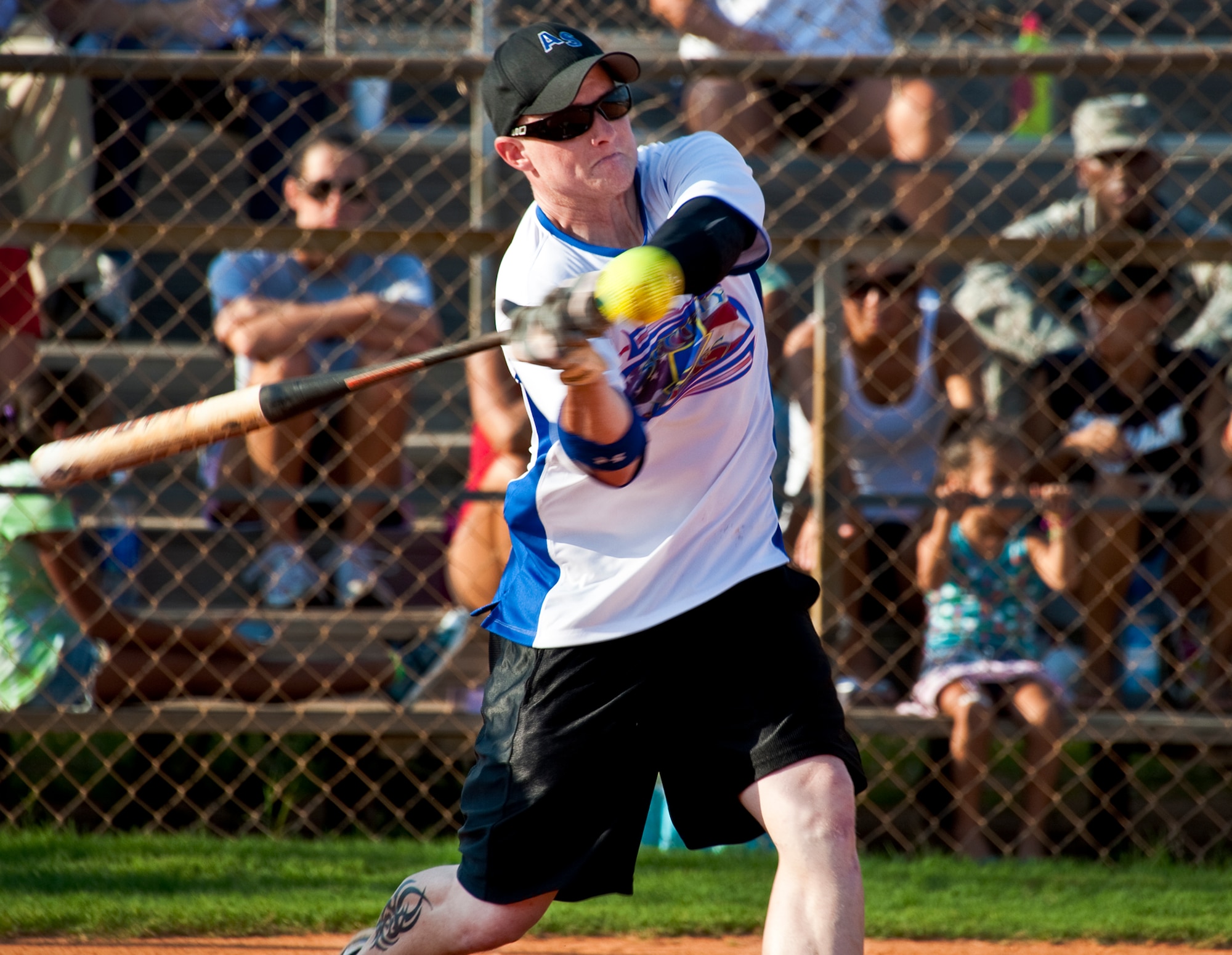 Travis Holcomb, of the 96th Security Forces Squadron, is all concentration as he swings at a high pitch.  SFS powered past the 96th Medical Group in the final two innings July 20 to win the intramural softball championship 16-15.  (U.S.  Air Force photo/Samuel King Jr.)