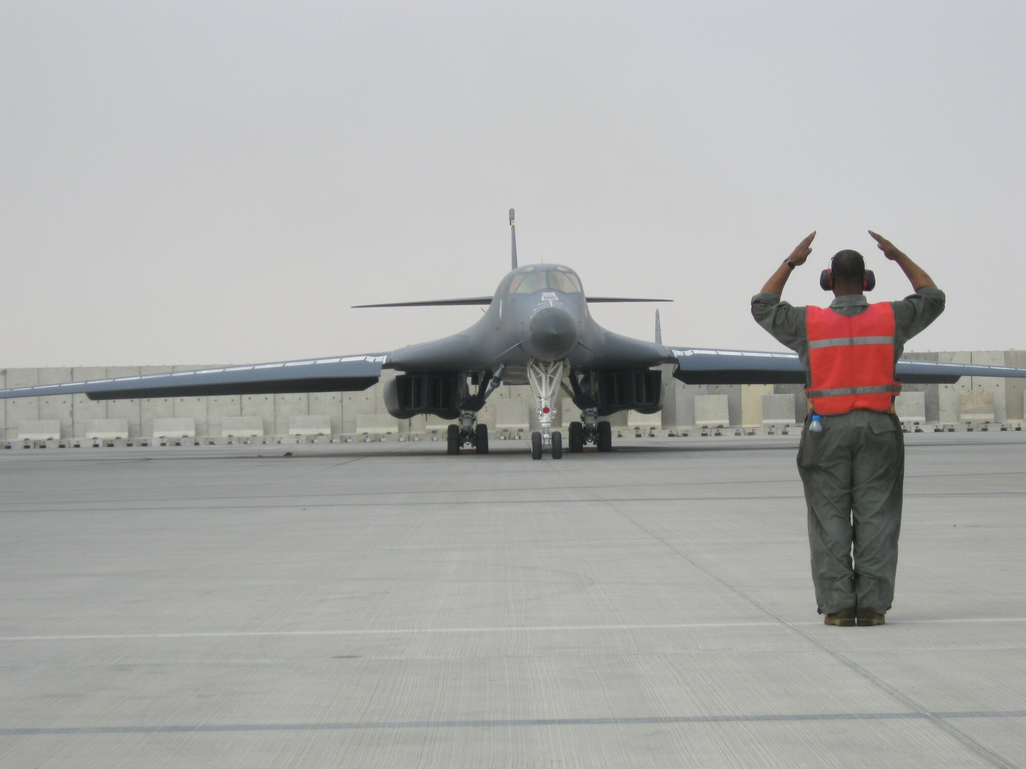 A B-1B Lancer is led off the ramp and onto the flightline before takeoff at an undisclosed location in Southwest Asia, July 7. The B-1B Lancers deployed here are maintained by the Airmen of the 37th Expeditionary Aircraft Maintenance Unit who recently won the base-level 'AMU of the Month' award for the sixth month in a row.
(U.S. Air Force photo/ Master Sgt. Christopher Garrettson)