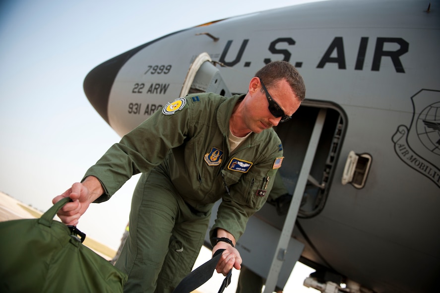 Capt. Chris Kidd, a 90th Expeditionary Air Refueling Squadron pilot, loads equipment onto a KC-135R Stratotanker aircraft before a flight July 20, 2011, at Incirlik Air Base, Turkey. The 90th EARS, a total-force team consisting of nearly 100 active-duty, Reserve and Air National Guard Airmen, conducts air-to-air refuels to C-17 Globemaster IIIs and C-5 Galaxies coming in and out of the area of operations. (U.S. Air Force photo by Tech. Sgt. Michael B. Keller/Released)