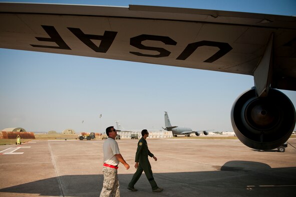 Maj. Trey Forrest, right, and Tech. Sgt. Michael Dymnioski, from the 90th Expeditionary Air Refueling Squadron, inspect a KC-135R Stratotanker aircraft before a flight July 20, 2011, at Incirlik Air Base, Turkey. The 90th EARS, a total-force team consisting of nearly 100 active-duty, Reserve and Air National Guard Airmen, conducts air-to-air refuels to C-17 Globemaster IIIs and C-5 Galaxies coming in and out of the area of operations. (U.S. Air Force photo by Tech. Sgt. Michael B. Keller/Released)