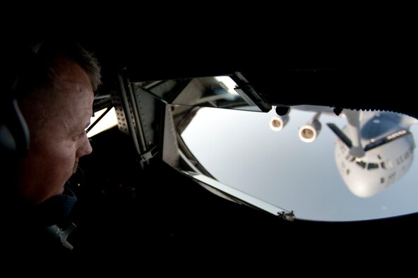 Master Sgt. Mark Heithoff, a 90th Expeditionary Air Refueling Squadron boom operator, guides the boom of a KC-135R Stratotanker aircraft to a C-17 Globemaster III aircraft July 20, 2011, over the Black Sea north of Turkey. The 90th EARS, a total-force team consisting of nearly 100 active-duty, Reserve and Air National Guard Airmen, conducts air-to-air refuels to C-17 Globemaster IIIs and C-5 Galaxies coming in and out of the area of operations. (U.S. Air Force photo by Tech. Sgt. Michael B. Keller/Released)