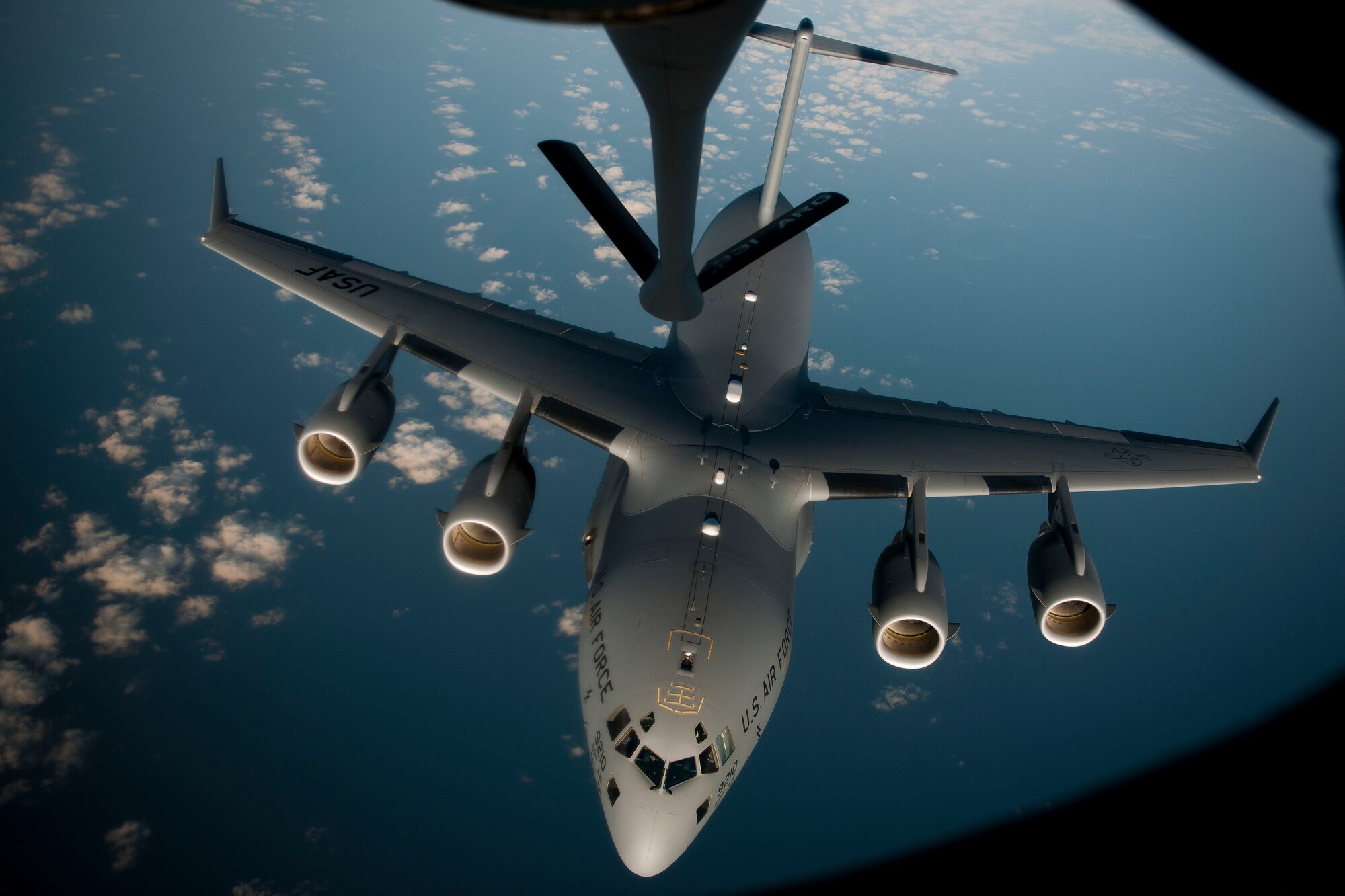 A C-17 Globemaster III aircraft disconnects from a 90th Expeditionary Air Refueling Squadron KC-135R Stratotanker aircraft during an air refueling training mission July 20, 2011, over the Black Sea north of Turkey. The 90th EARS, a total-force team consisting of nearly 100 active-duty, Reserve and Air National Guard Airmen, conducts air-to-air refuels to C-17 Globemaster IIIs and C-5 Galaxies coming in and out of the area of operations. (U.S. Air Force photo by Tech. Sgt. Michael B. Keller/Released)