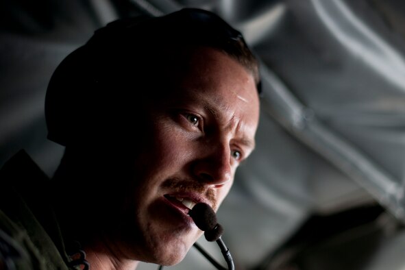 Capt. Chris Kidd, a 90th Expeditionary Air Refueling Squadron pilot, speaks with another crewmember onboard a KC-135R Stratotanker aircraft during an air refueling training mission July 20, 2011, over Turkey. The 90th EARS, a total-force team consisting of nearly 100 active-duty, Reserve and Air National Guard Airmen, conducts air-to-air refuels to C-17 Globemaster IIIs and C-5 Galaxies coming in and out of the area of operations. (U.S. Air Force photo by Tech. Sgt. Michael B. Keller/Released)
