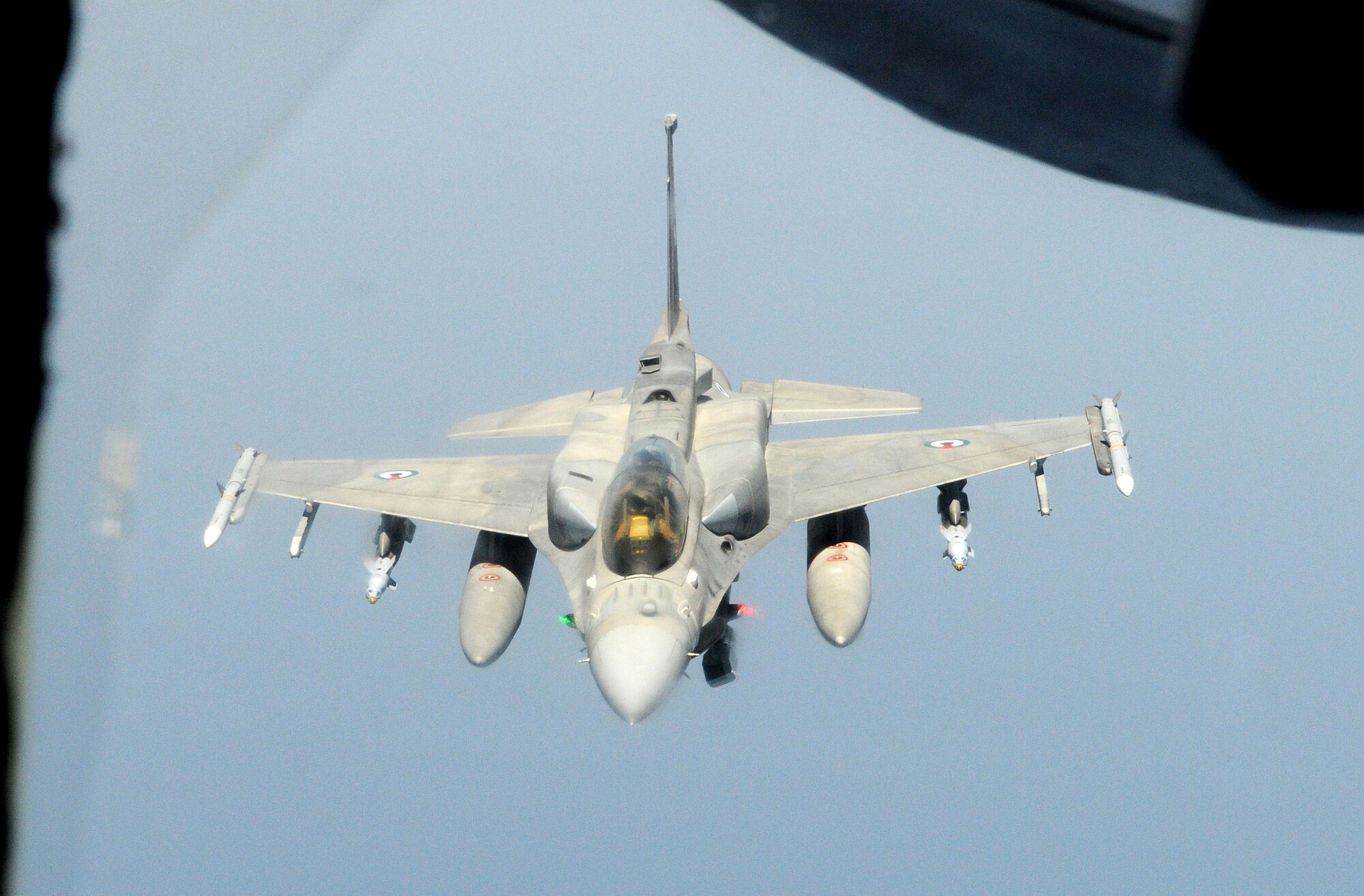 RAF MILDENHALL, England – A United Arab Emirates F-16F Desert Falcon flies away from a 100th Air Refueling Wing KC-135 Stratotanker after receiving fuel over the Mediterranean Sea July 19, 2011. Since March, the 100th ARW has off-loaded more than 40 million pounds of fuel to more than 4,000 receivers in support of the NATO-led Operation Unified Protector. (U.S. Air Force photo/Staff Sgt. Thomas Trower)