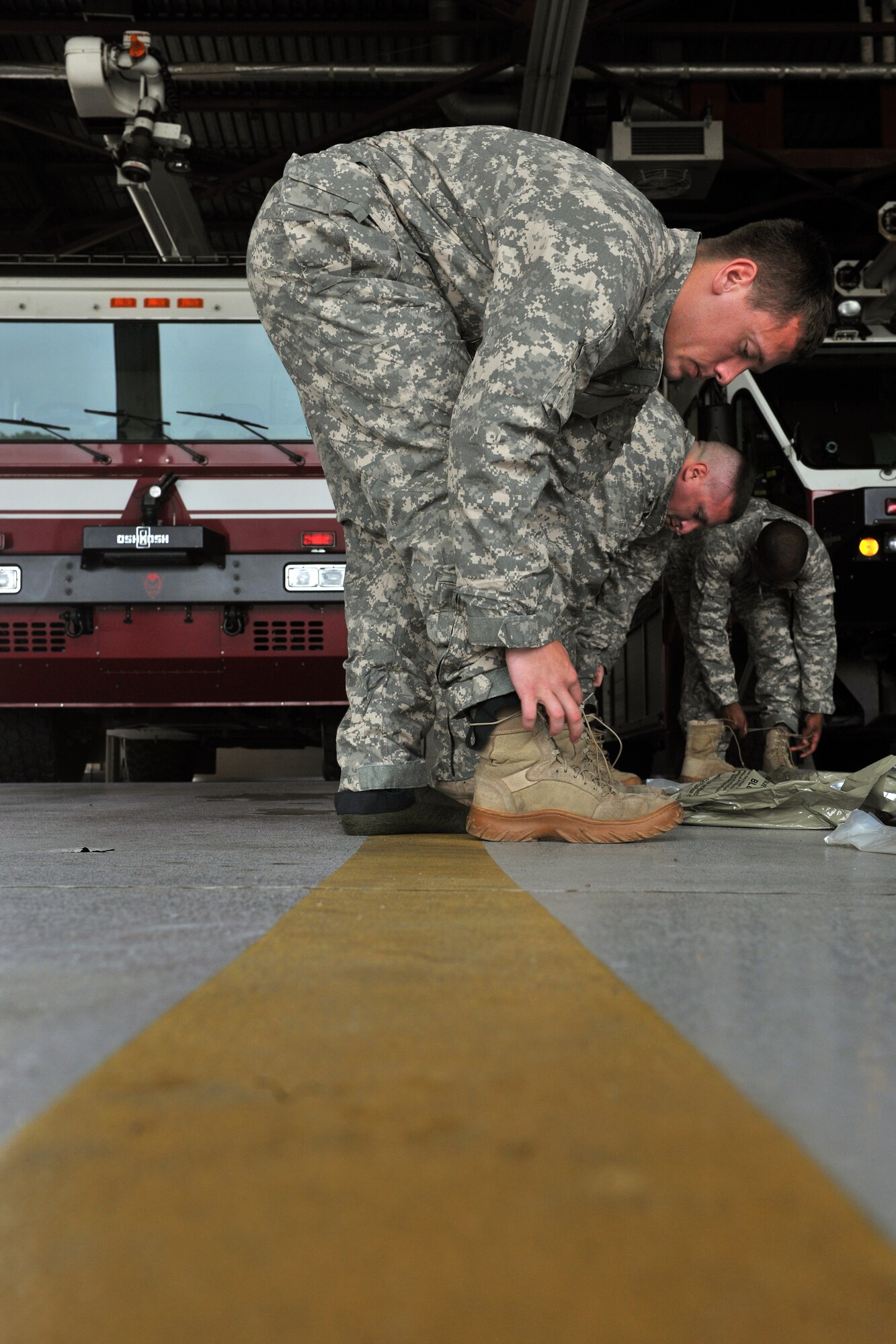 KUNSAN AIR BASE, Republic of Korea -- Airmen from the 8th Civil Engineer Squadron’s explosive ordnance disposal flight and emergency management flight, along with the 8th Medical Operations Squadron’s bioenvironmental engineering flight try on the Joint Firefighter's Integrated Response Ensemble Mod one-piece suit here July 22. Airmen were participating in a final field evaluation of the suit testing its design, fit and fabric. (U.S. Air Force photo/Senior Airman Brittany Y. Bateman)