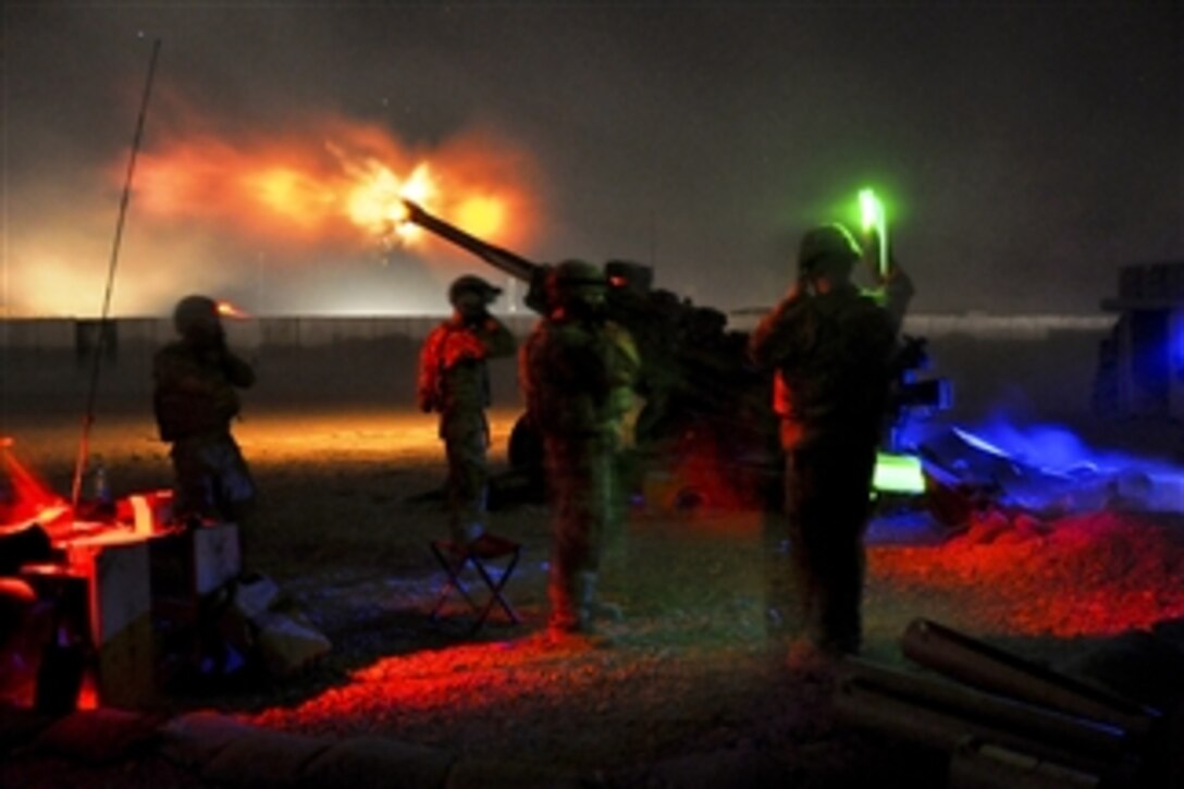 U.S. Army soldiers light up the night by firing illumination from their M777A2, 155mm howitzer at suspected enemy movements from Forward Operating Base Pasab in Zharay district in Afghanistan's Zabul province on July 20, 2011.  The soldiers are assigned to Bravo Battery of the Automatic Battalion, 2nd Battalion, 8th Field Artillery Regiment.  