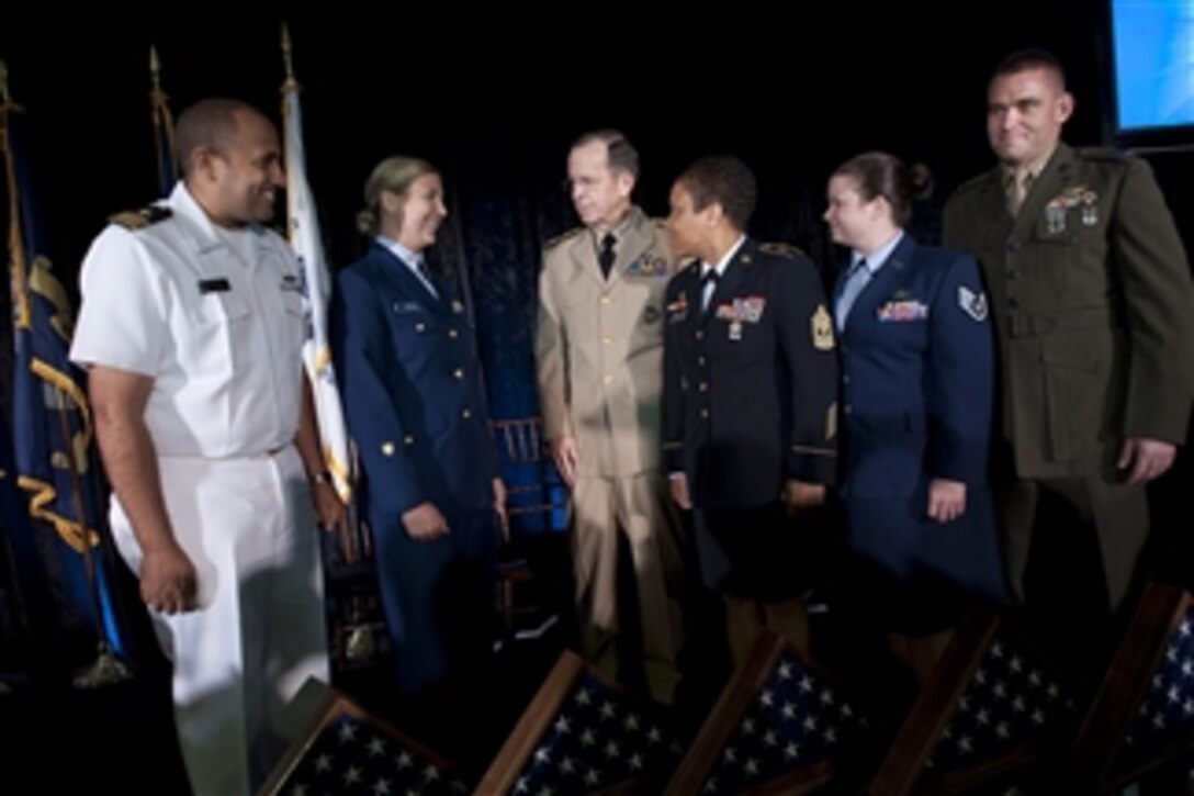 Chairman of the Joint Chiefs of Staff Adm. Mike Mullen greets the 2011 Military Times Service Members of the Year U.S. Navy Lt. Cmdr. Michael D. Files (left), U.S. Coast Guard Petty Officer 2nd Class Nicole C. Emmons, U.S. Army 1st Sgt. Monekia Y. Denkins (3rd from right), U.S. Air Force Staff Sgt. Lindsay W. Bell and U.S. Marine Corps Capt. David J. Cote (right) at the Cannon House Office Building in Washington, D.C., on July 21, 2011.  