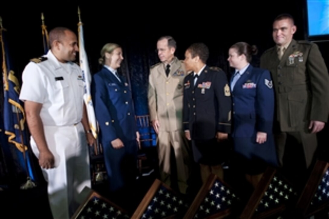 Navy Adm. Mike Mullen, chairman of the Joint Chiefs of Staff, greets the 2011 Military Times Service Members of the Year, from left, Navy Lt. Cmdr. Michael D. Files, Coast Guard Petty Officer 2nd Class Nicole C. Emmons, Army 1st Sgt. Monekia Y. Denkins, Air Force Staff Sgt. Lindsay W. Bell and Marine Corps Capt. David J. Cote in Washington, D.C., July 21, 2011.