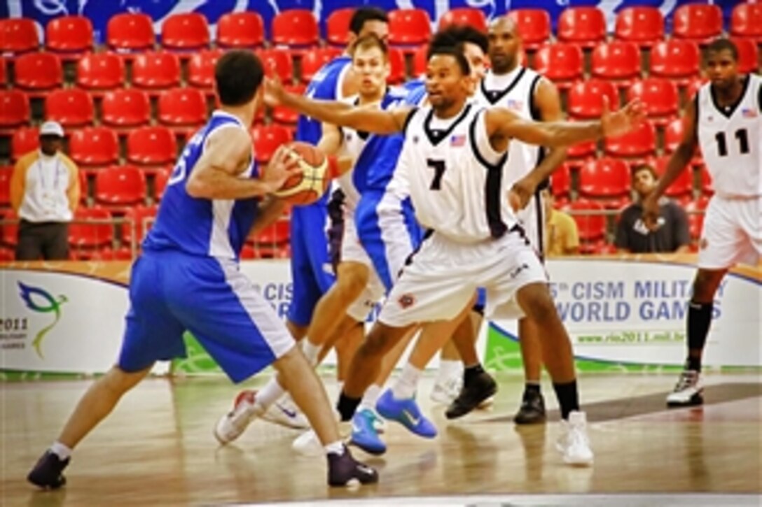 U.S. Army 2nd Lt. Cleveland Richard defends against his opponent from Greece during the 5th International Military Sports Council World Games in Rio de Janeiro. The U.S. team went on to win the emotionally charged game 82-76 and advanced undefeated July 21, 2011. The games run from July 16 to 24 and are aimed at fostering peace and friendship among the 7,000 troops from more than 100 countries participating.