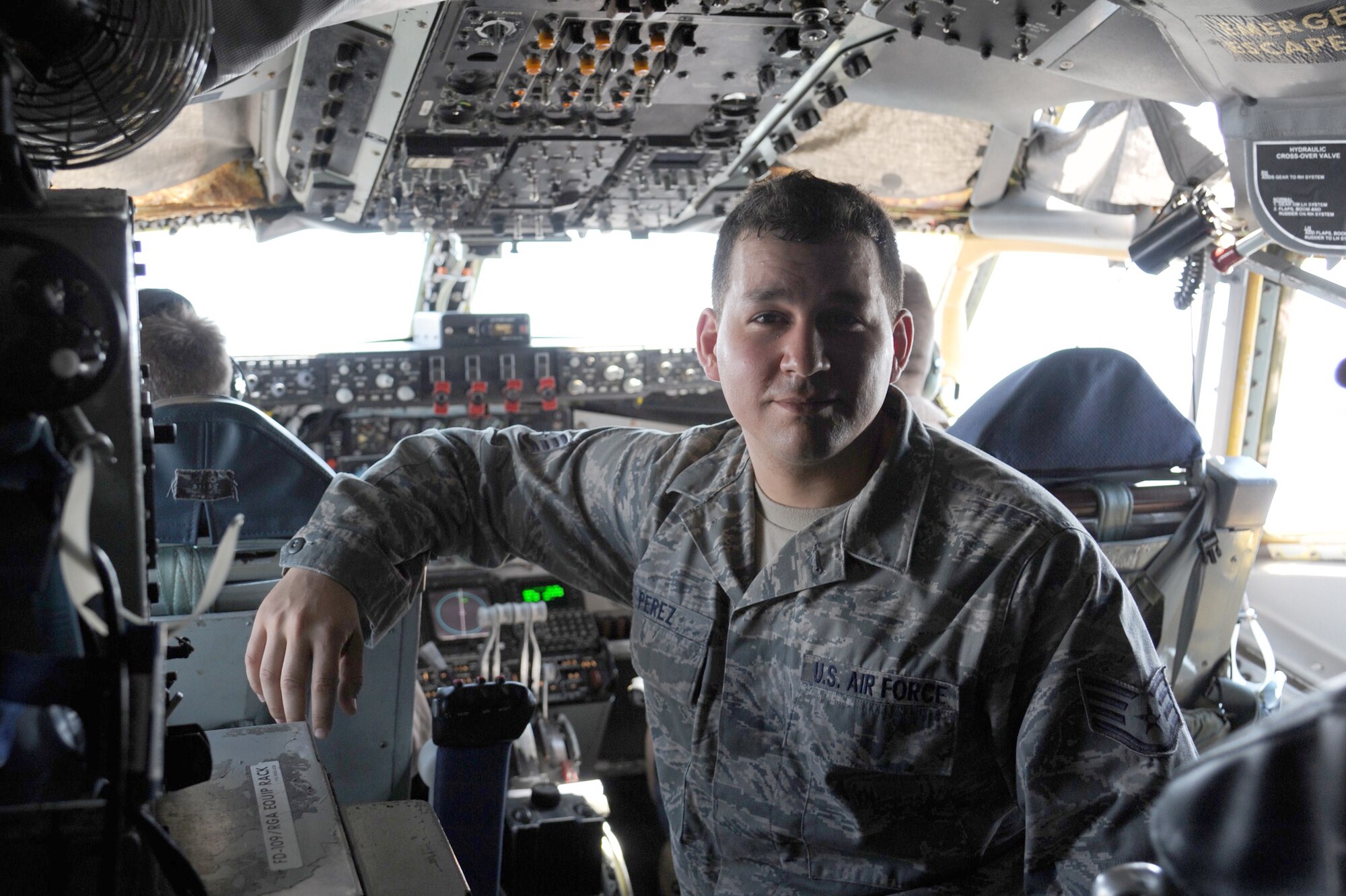 Staff Sgt. Adrian Perez poses for a photo during a KC-135 Stratotanker incentive flight while flying over Kyrgyzstan July 22. Perez is a 376th Logistics Readiness Squadron supply warehouse supervisor. He is deployed to the Transit Center at Manas from Hurlburt Field, Fla. (U.S. Air Force photo/Tech. Sgt. Hank Hoegen)
