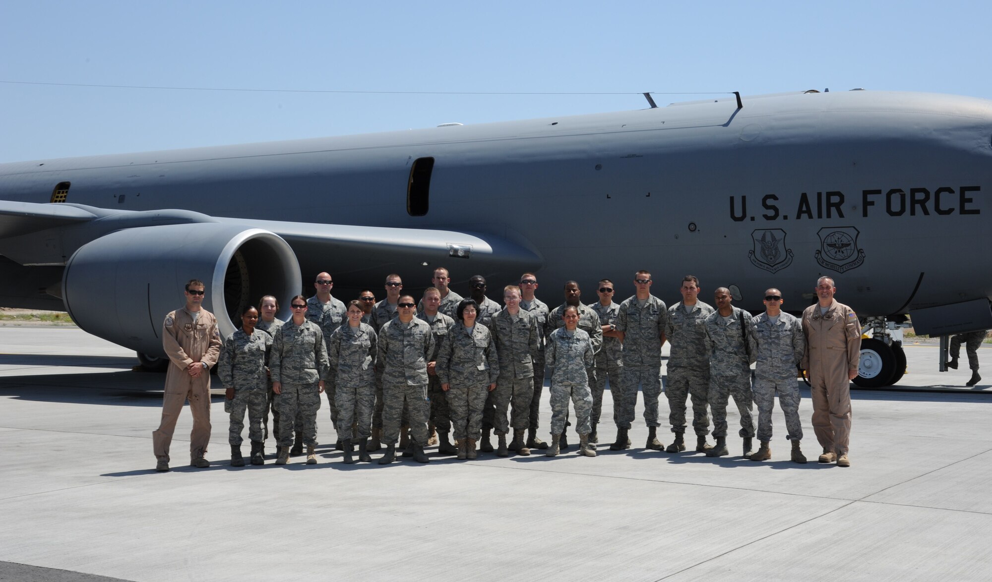 A group of award winners and star performers from the Transit Center at Manas, Kyrgyzstan, pose for a photo with a 22nd Expeditionary Air Refueling Squadron aircrew before receiving an incentive flight in a KC-135 Stratotanker July 22. (U.S. Air Force photo/Tech. Sgt. Hank Hoegen) 