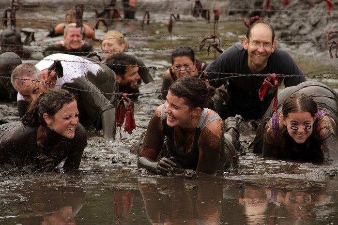 Despite some Warrior Dash participants' best efforts to stay relatively mud-free, most competitors found themselves covered from the neck down in muck after completing the 3.2-mile course July 24. Others relished the experience and dove in head first to create a post-race photo opportunity. For more information about the event, visit www.warriordash.com.