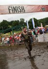 A Warrior Dash participant makes his way past the finish line during Sunday's race, which drew more than 8,900 competitors. Saturday's race drew nearly 10,500 athletes. The top finisher was 25-year-old Jason Quarford who completed the course with a 7:31 pace per mile. For more information about the event, visit www.warriordash.com.