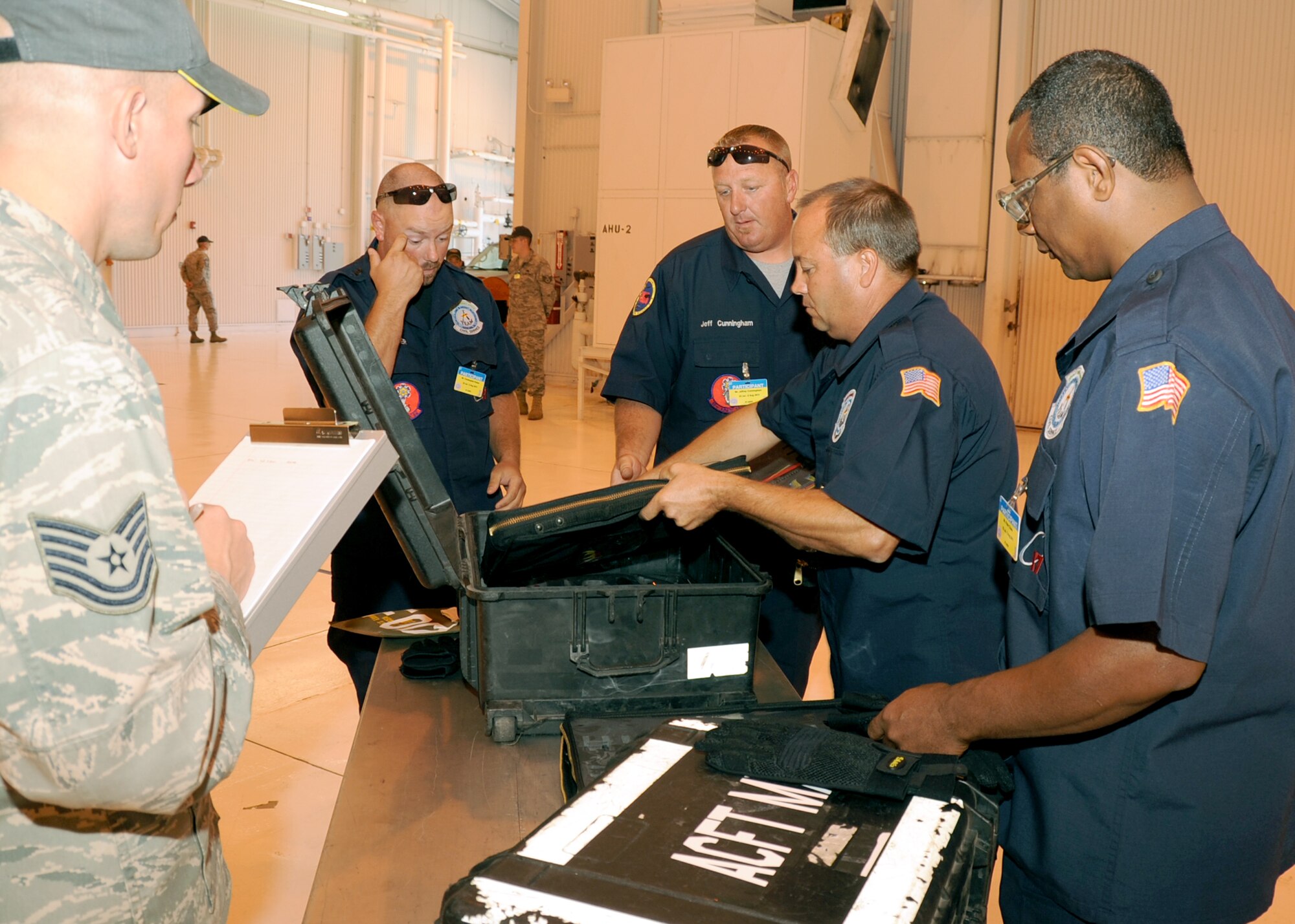 JOINT BASE LEWIS-MCCHORD, Wash. – Brice Parker, Jeffrey Cunningham, Shawn Pyle and Pete Chase, 97th Maintenance Directorate Rodeo team members inspect tool boxes during one of many tasks of the Maintenance Skills Competitions as part of the 2011 Air Mobility Command Rodeo July 24, 2011. Rodeo is the U.S. Air Force's and Air Mobility Command’s premier international combat skill and flying operations competition designed to develop and improve techniques, procedures and interoperability, while optimizing international mobility partnerships and enhancing mobility operations. (U.S. Air Force photo by Airman 1st Class Kenneth W. Norman / Released / 97th Air Mobility Wing Rodeo Public Affairs)